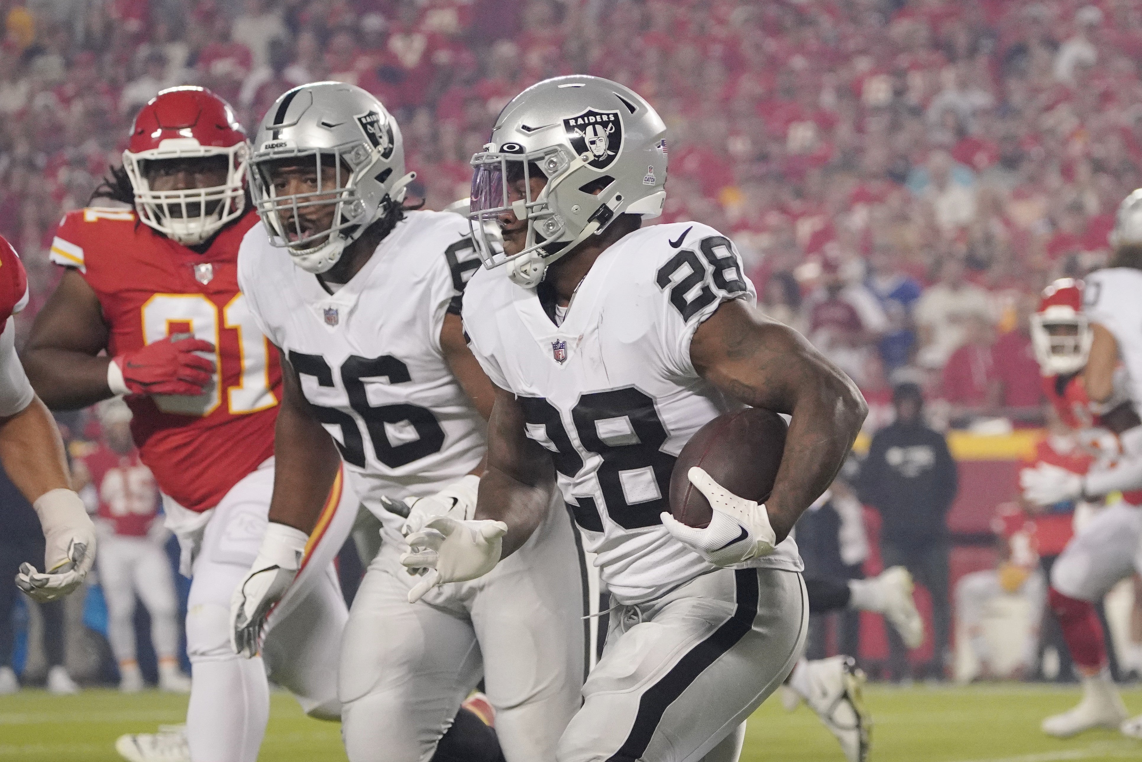 Oct 10, 2022; Kansas City, Missouri, USA; Las Vegas Raiders running back Josh Jacobs (28) runs the ball in the first quarter against the Kansas City Chiefs at GEHA Field at Arrowhead Stadium.