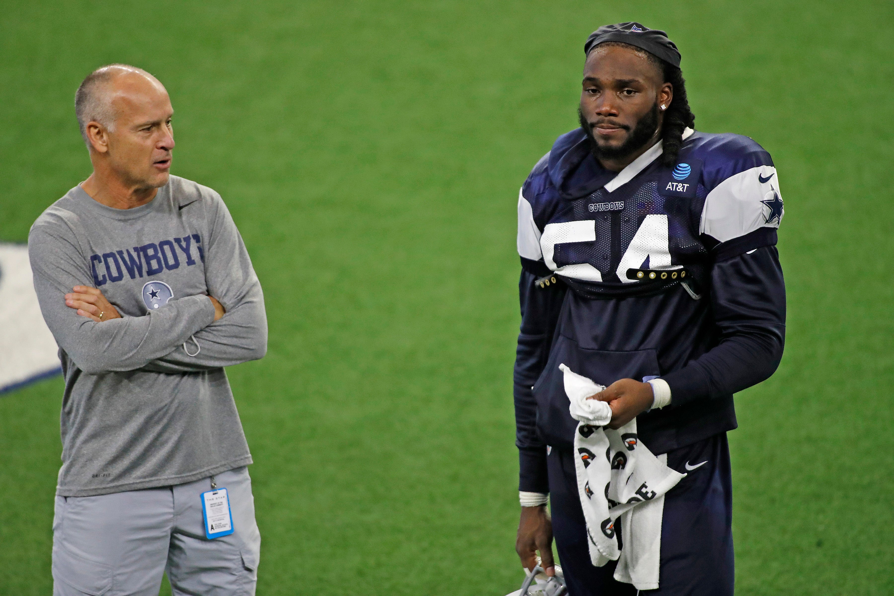 Aug 24, 2020; Frisco, TX, USA; Dallas Cowboys player Jaylon Smith (right) talks with Mike Nolan during training camp at Ford Center at The Star in Frisco, Texas.