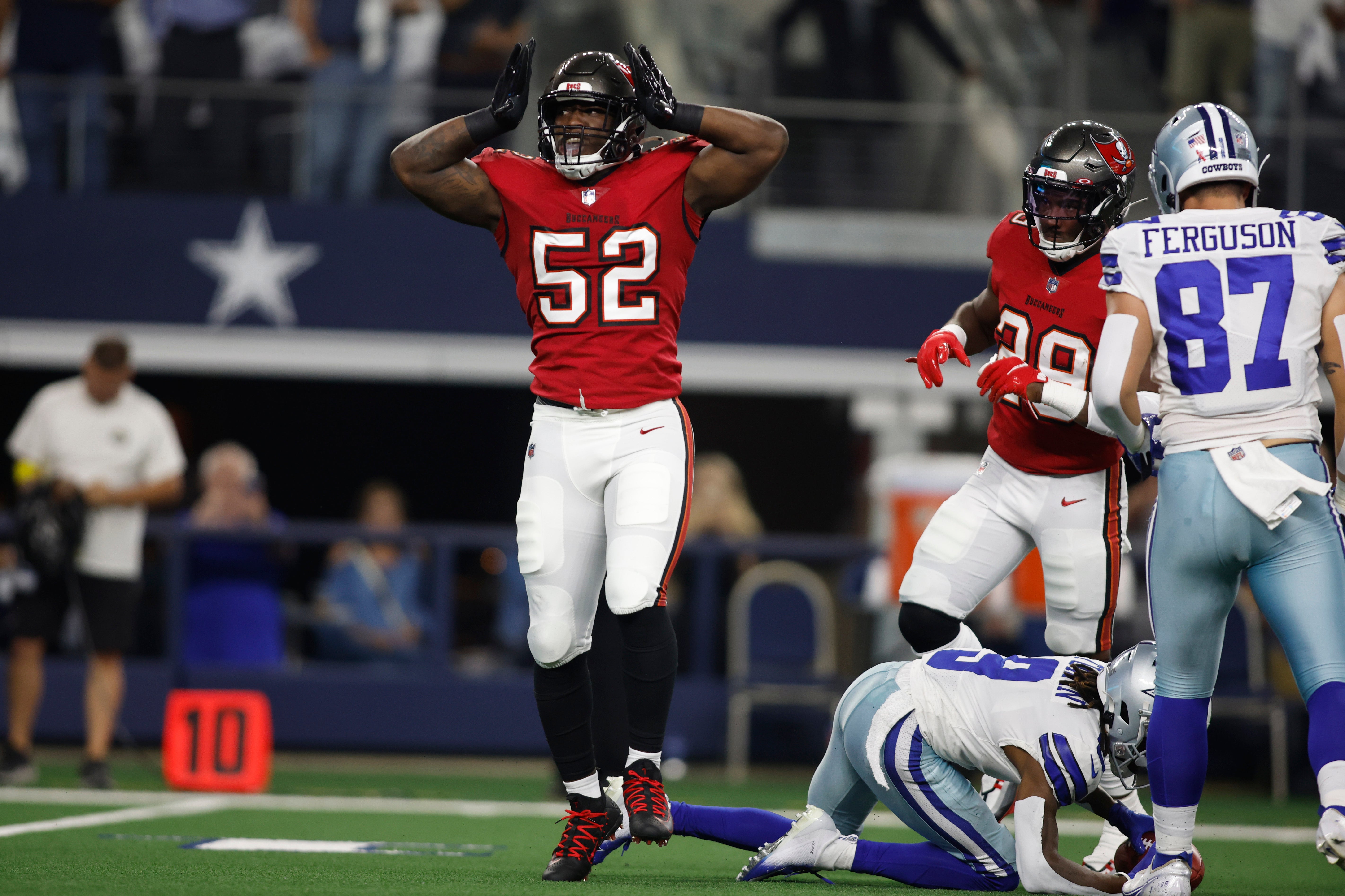 Sep 11, 2022; Arlington, Texas, USA; Tampa Bay Buccaneers linebacker K.J. Britt (52) reacts after making a tackle in the first quarter against the Tampa Bay Buccaneers at AT&T Stadium.