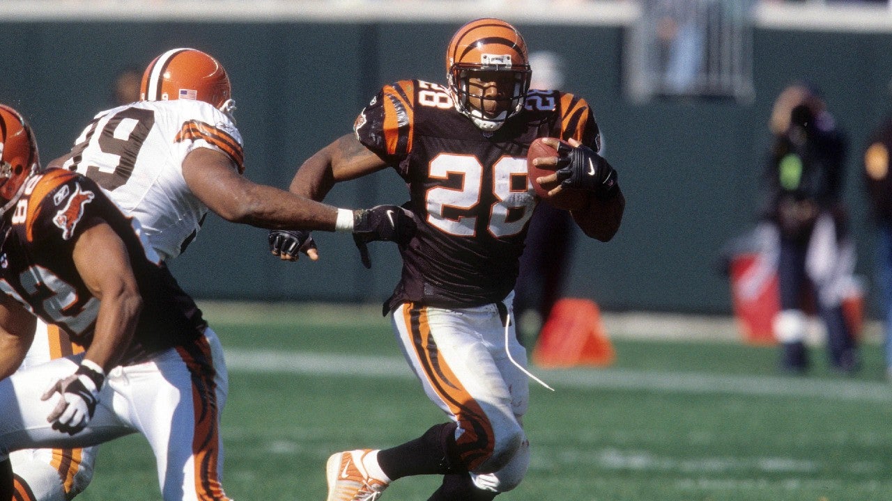 Oct 14, 2001; Cincinnati, OH, USA; Cincinnati Bengals running back Corey Dillon (28) runs with the ball during the game against the Cleveland Browns at Paul Brown Stadium. The Bengals beat the Browns 24-14. Mandatory Credit: Matthew Emmons-USA TODAY Sports