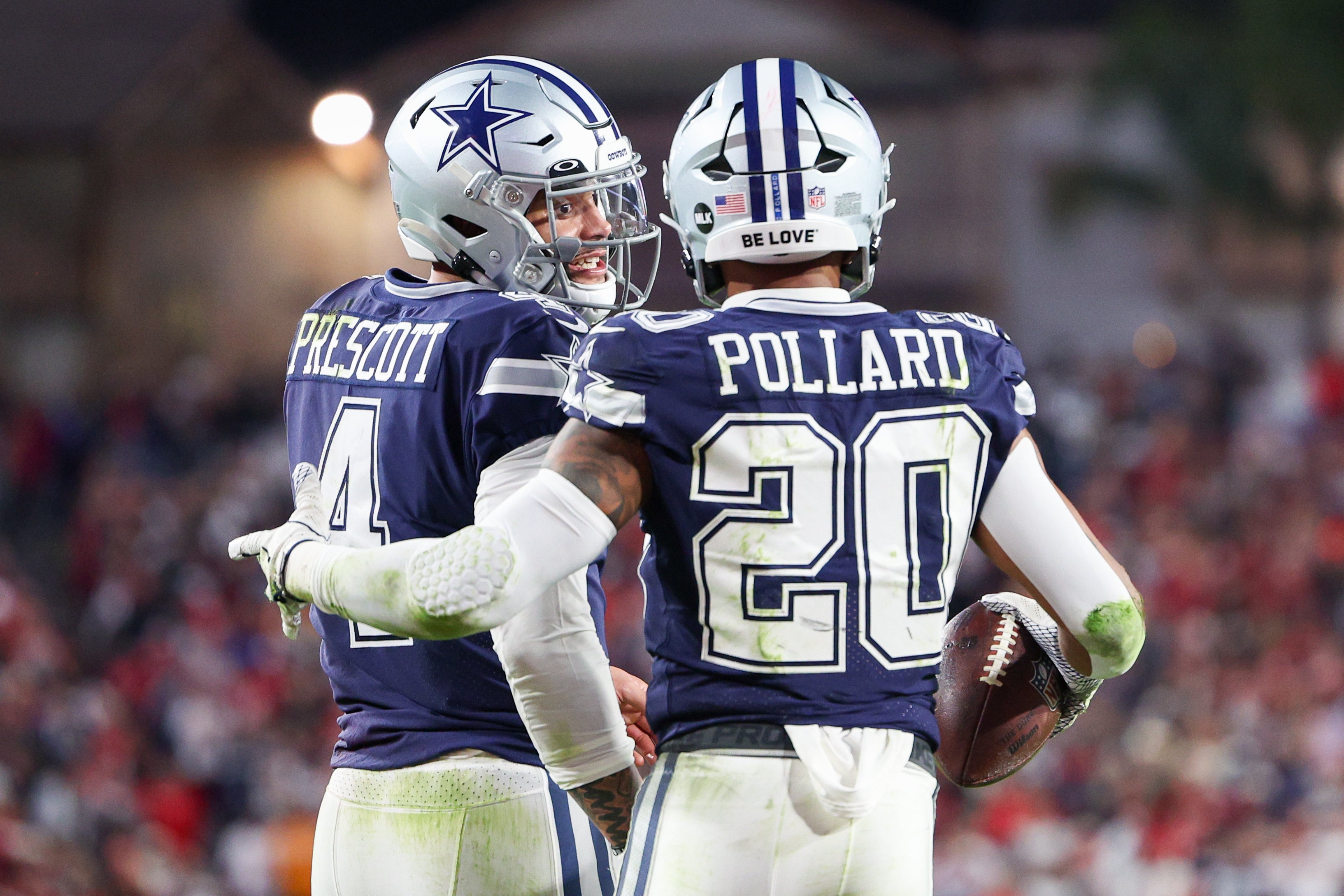 Jan 16, 2023; Tampa, Florida, USA; Dallas Cowboys quarterback Dak Prescott (4) and running back Tony Pollard (20) react after a play against the Tampa Bay Buccaneers in the second quarter during a wild card game at Raymond James Stadium.