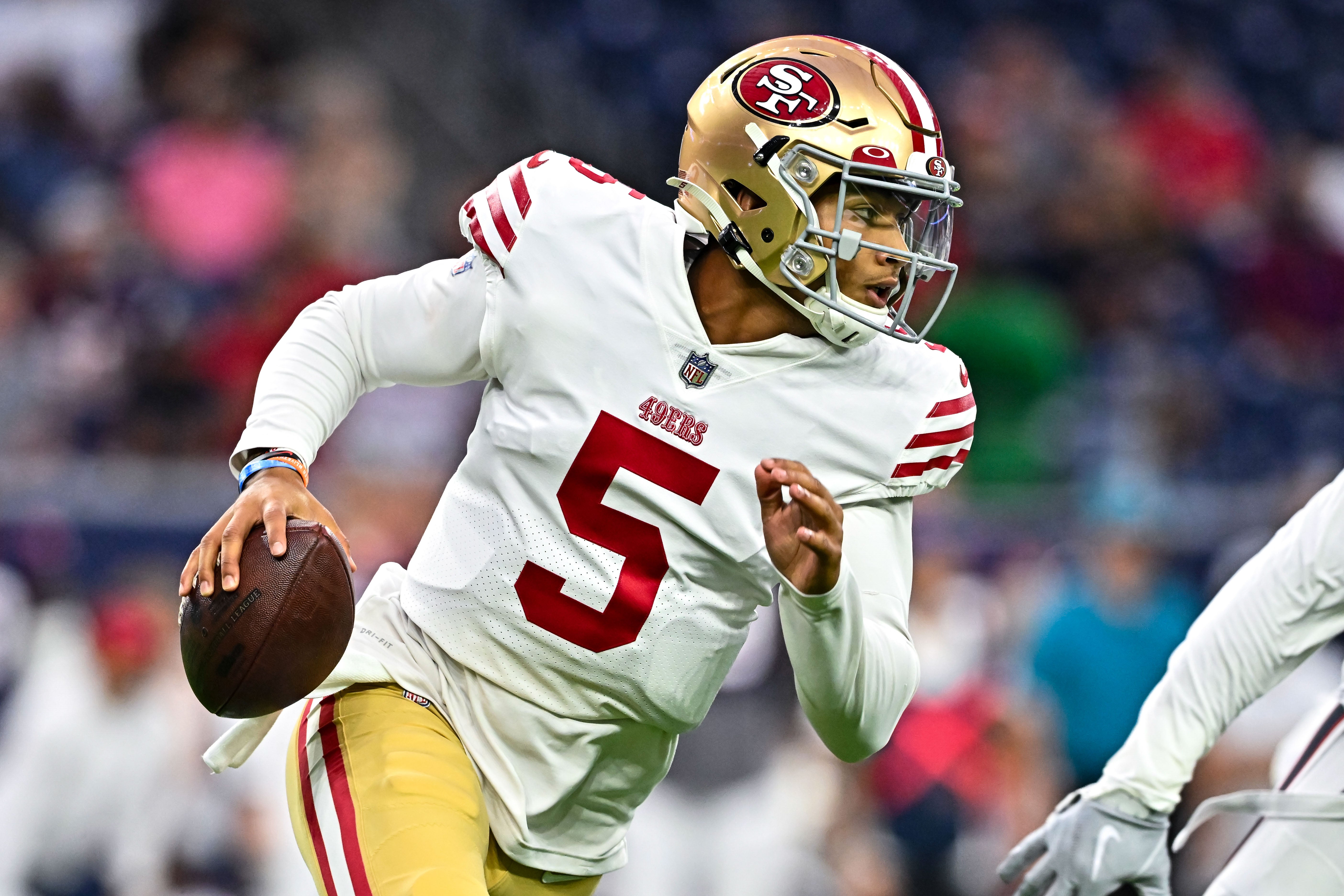 Aug 25, 2022; Houston, Texas, USA; San Francisco 49ers quarterback Trey Lance (5) runs the ball during the first quarter gainst the Houston Texans at NRG Stadium. Mandatory Credit: Maria Lysaker-USA TODAY Sports