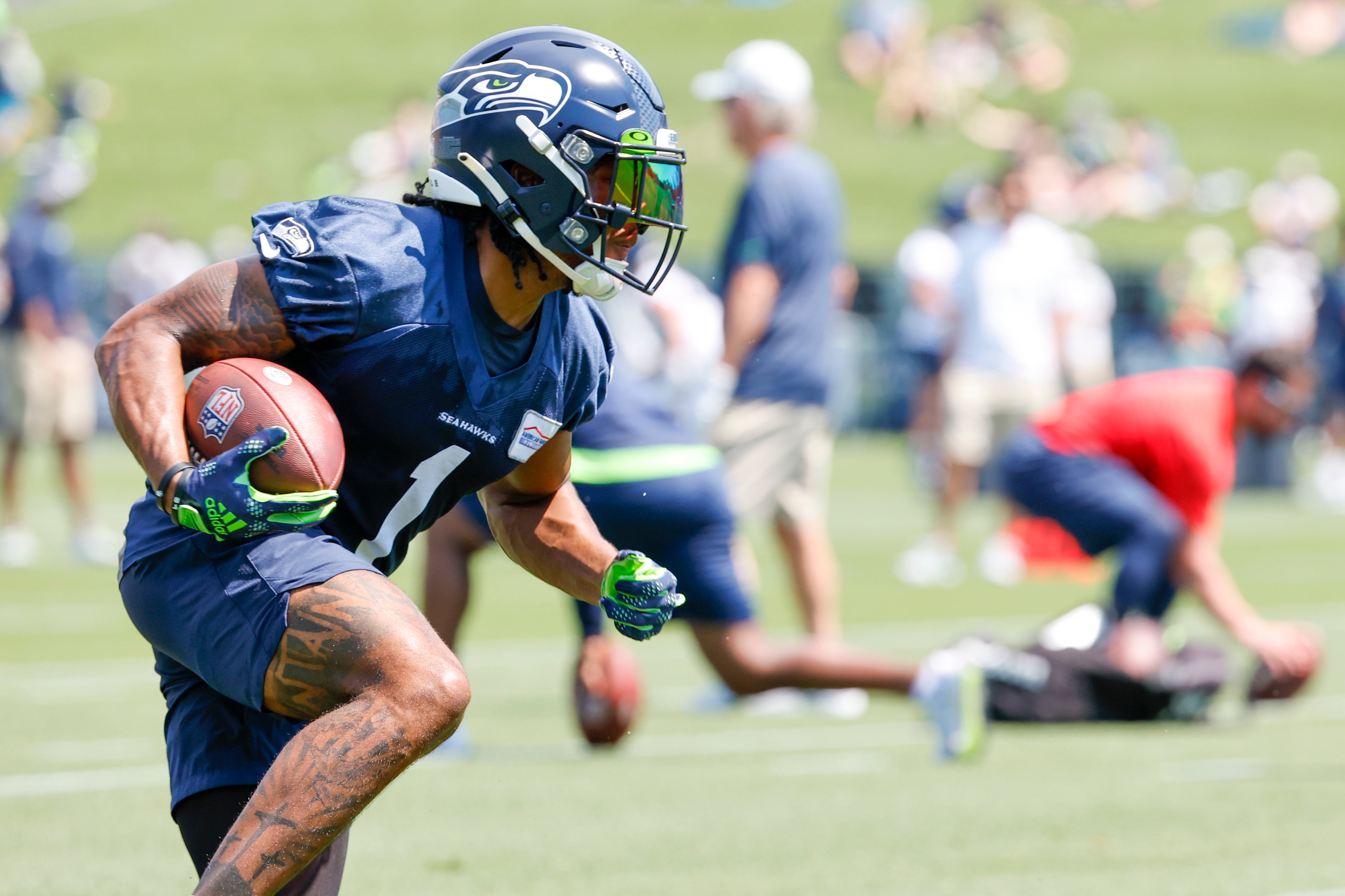 Jul 27, 2022; Renton, WA, USA; Seattle Seahawks wide receiver Dee Eskridge (1) runs for yards after the catch during training camp practice at Virginia Mason Athletic Center. Mandatory Credit: Joe Nicholson-USA TODAY Sports
