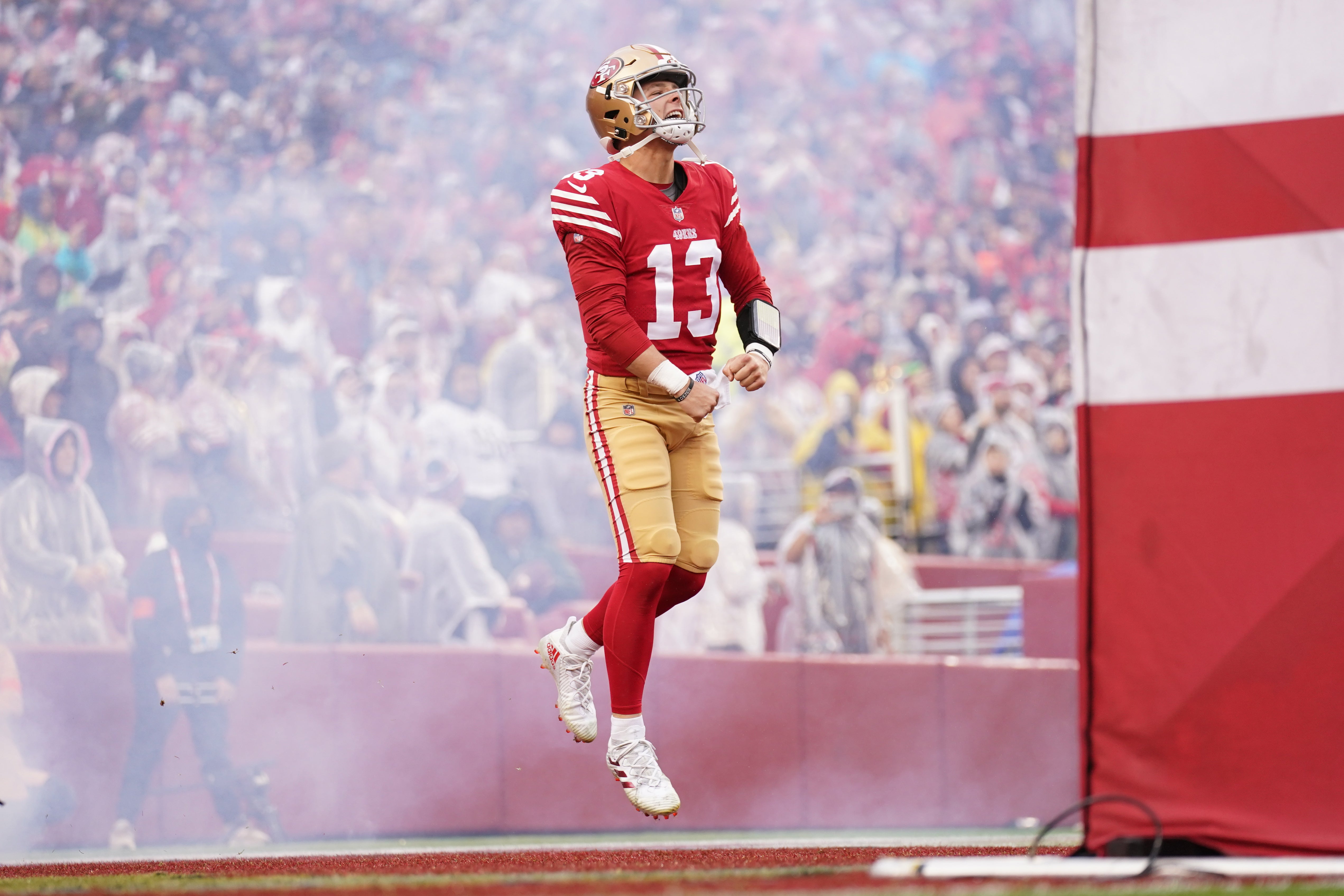 Jan 14, 2023; Santa Clara, California, USA; San Francisco 49ers quarterback Brock Purdy (13) runs onto the field before a wild card game against the Seattle Seahawks at Levi's Stadium. Mandatory Credit: Cary Edmondson-USA TODAY Sports