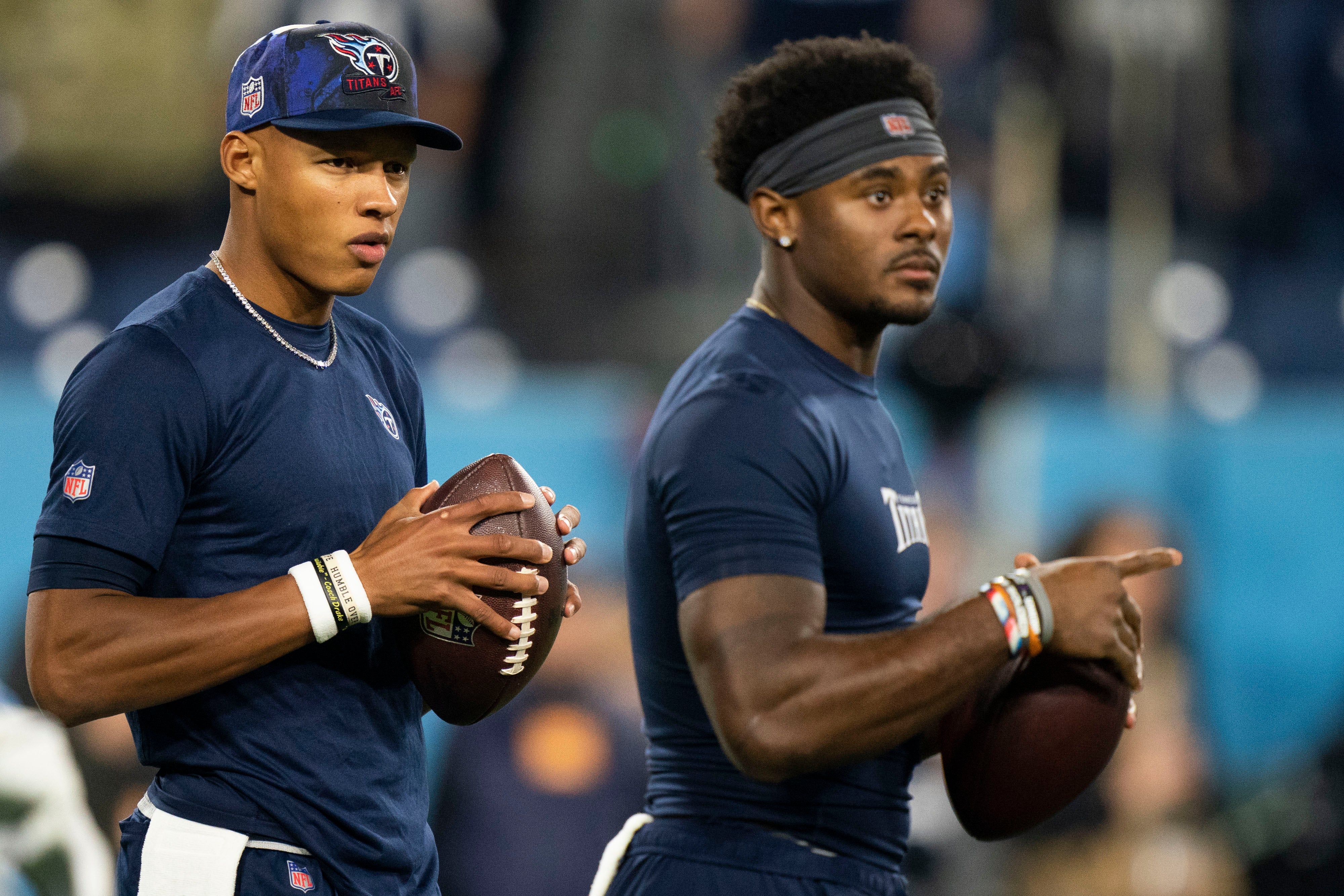 Dec 29, 2022; Nashville, Tennessee, USA; Tennessee Titans quarterbacks Joshua Dobbs (11) and Malik Willis (7) warm up before the game against the Dallas Cowboys at Nissan Stadium.
