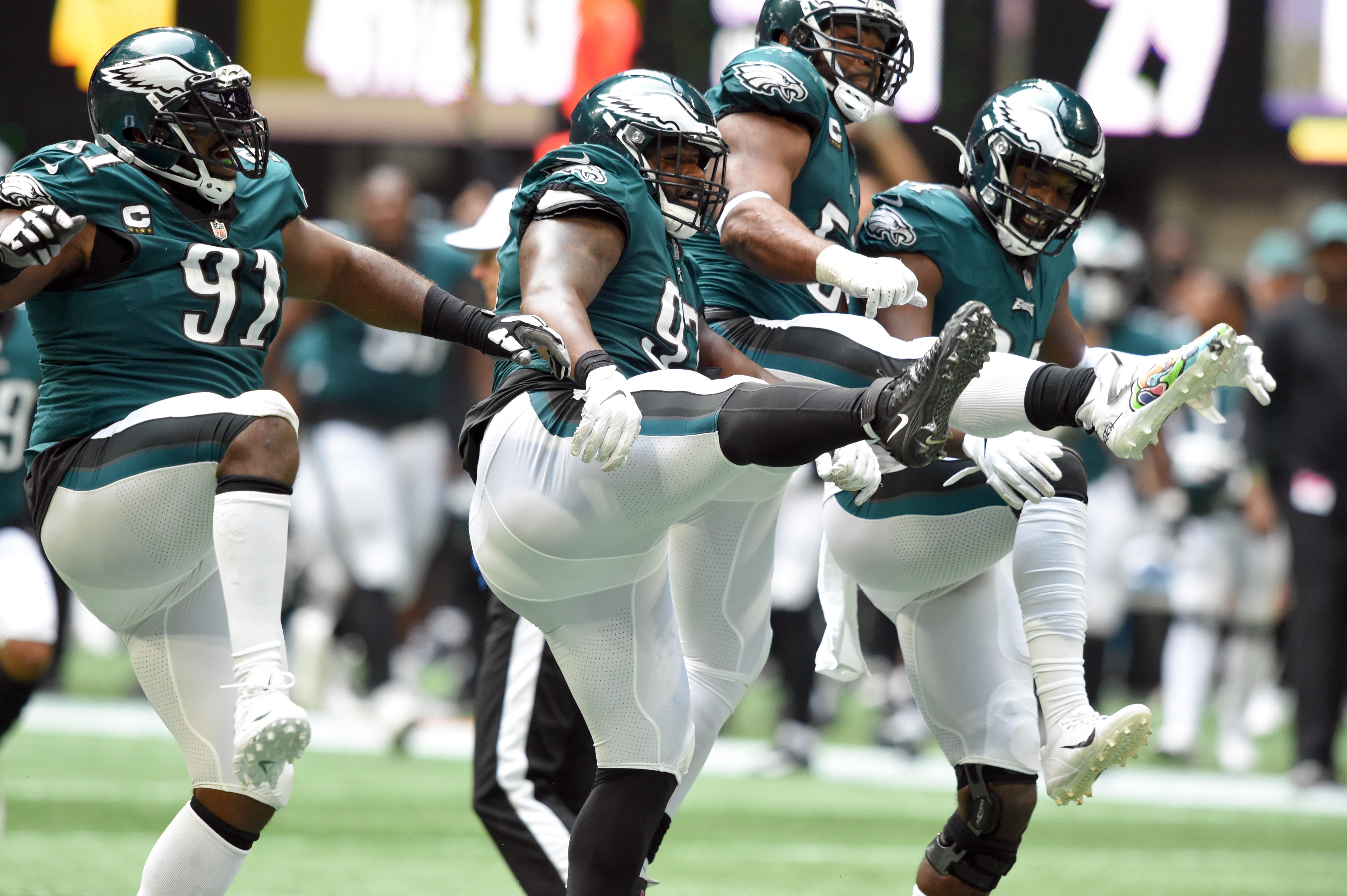 ep 12, 2021; Atlanta, Georgia, USA; Philadelphia Eagles defensive tackle Fletcher Cox (91) defensive tackle Javon Hargrave (97) defensive end Brandon Graham (55) and defensive end Josh Sweat (94) celebrate after Hargrave sacked Atlanta Falcons quarterback Matt Ryan (2) during the fourth quarter at Mercedes-Benz Stadium.