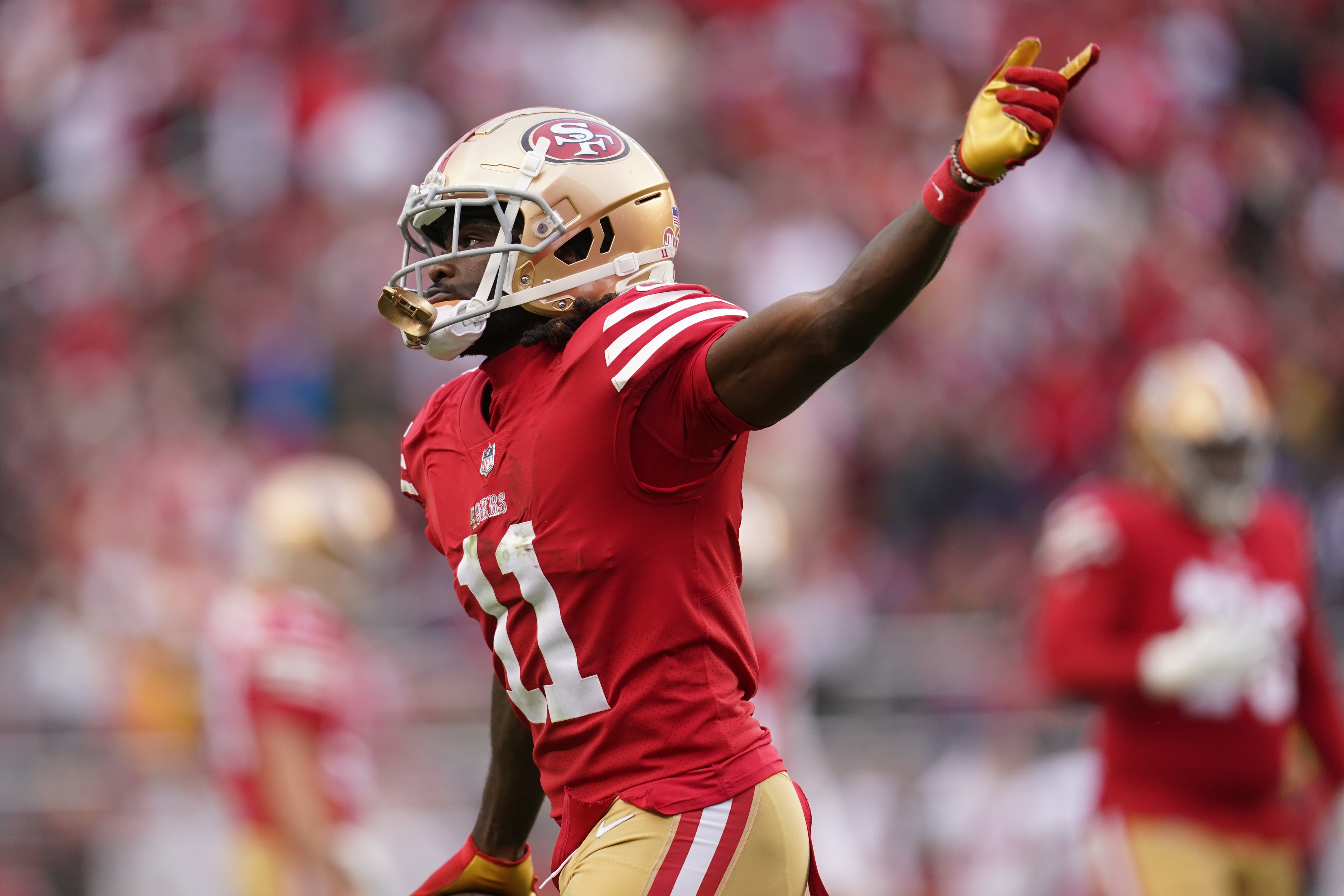 Dec 11, 2022; Santa Clara, California, USA; San Francisco 49ers wide receiver Brandon Aiyuk (11) celebrates after catching a touchdown pass against the Tampa Bay Buccaneers in the second quarter at Levi's Stadium. Mandatory Credit: Cary Edmondson-USA TODAY Sports