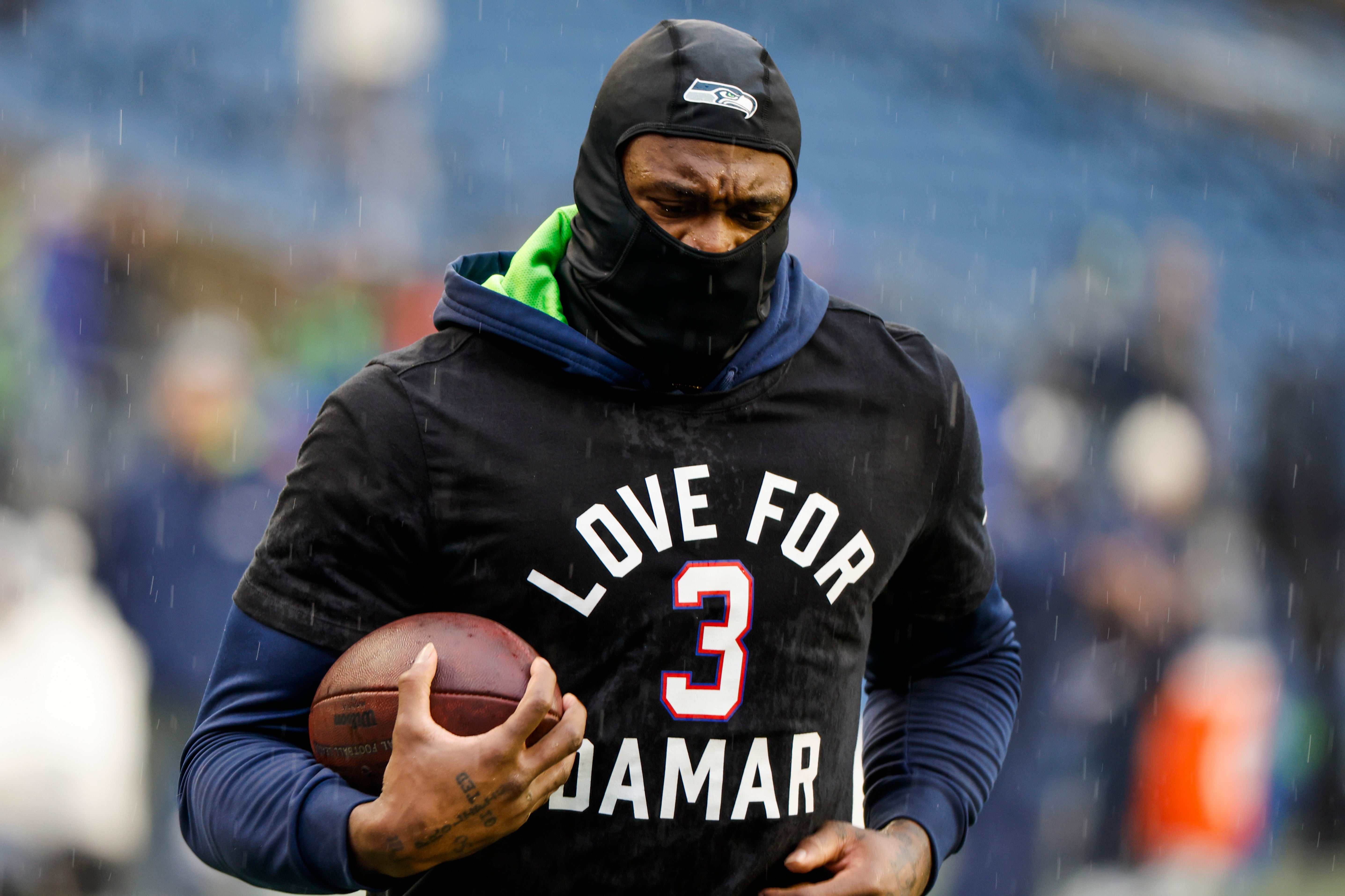 Jan 8, 2023; Seattle, Washington, USA; Seattle Seahawks wide receiver DK Metcalf (14) participates in early pregame warmups against the Los Angeles Rams while wearing a Love for Damar t-shirt in honor of Buffalo Bills safety Damar Hamlin (3, not pictured) at Lumen Field.