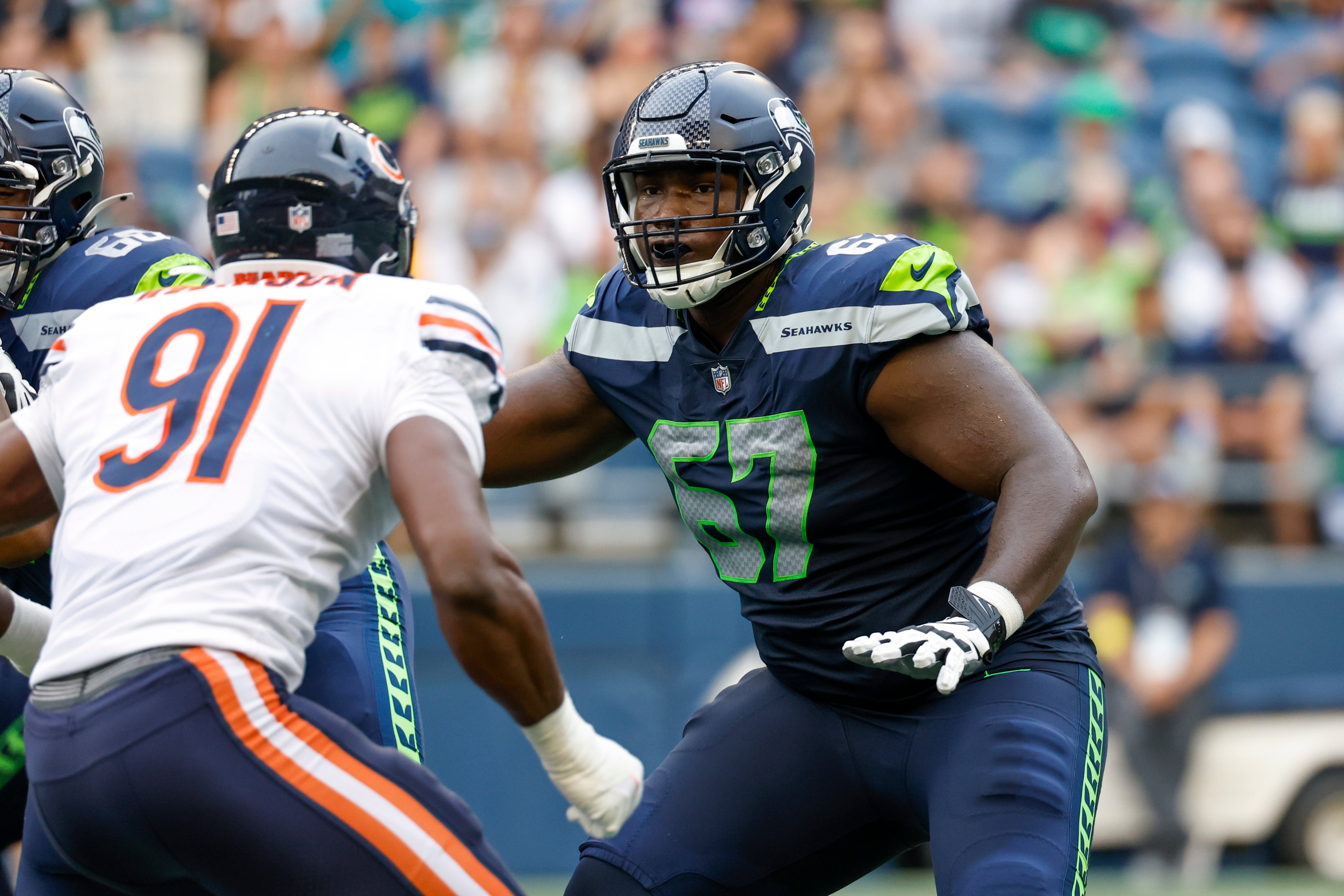 Aug 18, 2022; Seattle, Washington, USA; Seattle Seahawks offensive tackle Charles Cross (67) blocks against the Chicago Bears during the second quarter at Lumen Field. Mandatory Credit: Joe Nicholson-USA TODAY Sports