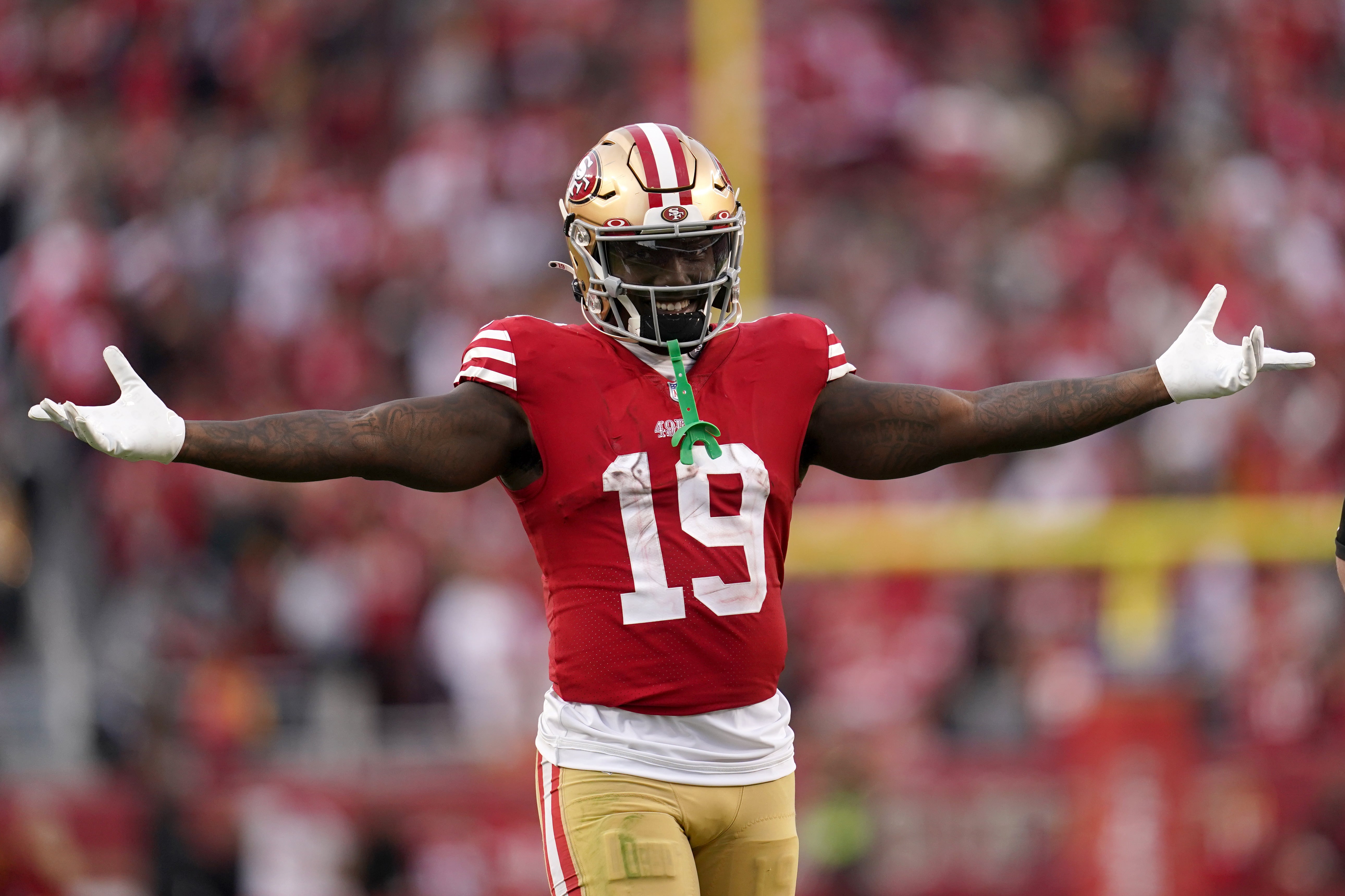 Nov 27, 2022; Santa Clara, California, USA; San Francisco 49ers wide receiver Deebo Samuel (19) gestures as he walks towards the team huddle after the New Orleans Saints turned the ball over on downs in the fourth quarter at Levi's Stadium. Mandatory Credit: Cary Edmondson-USA TODAY Sports