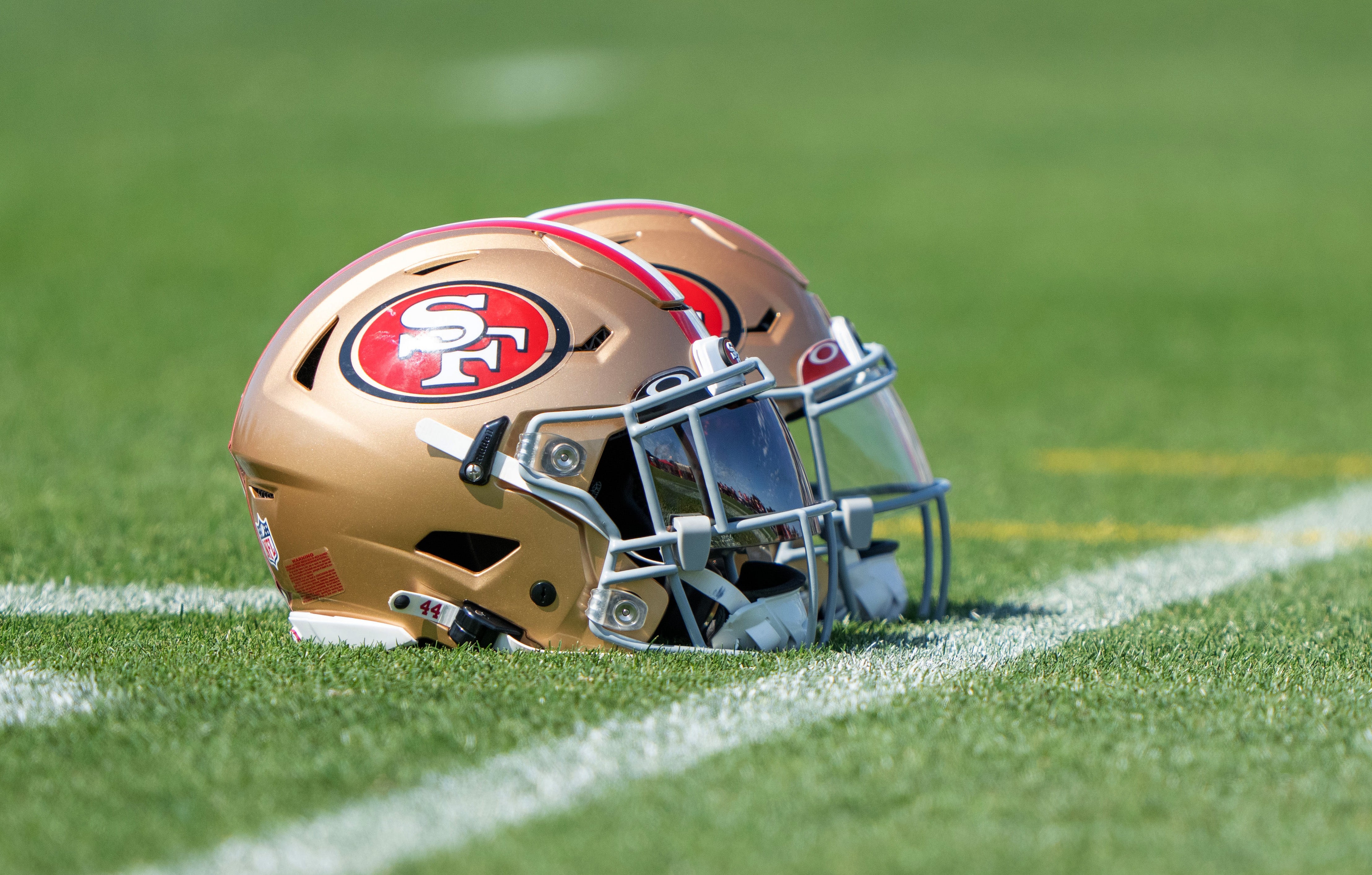 Jul 28, 2022; Santa Clara, CA, USA; San Francisco 49ers helmets on the turf during training camp at the SAP Performance Facility near Levi Stadium. Mandatory Credit: Stan Szeto-USA TODAY Sports
