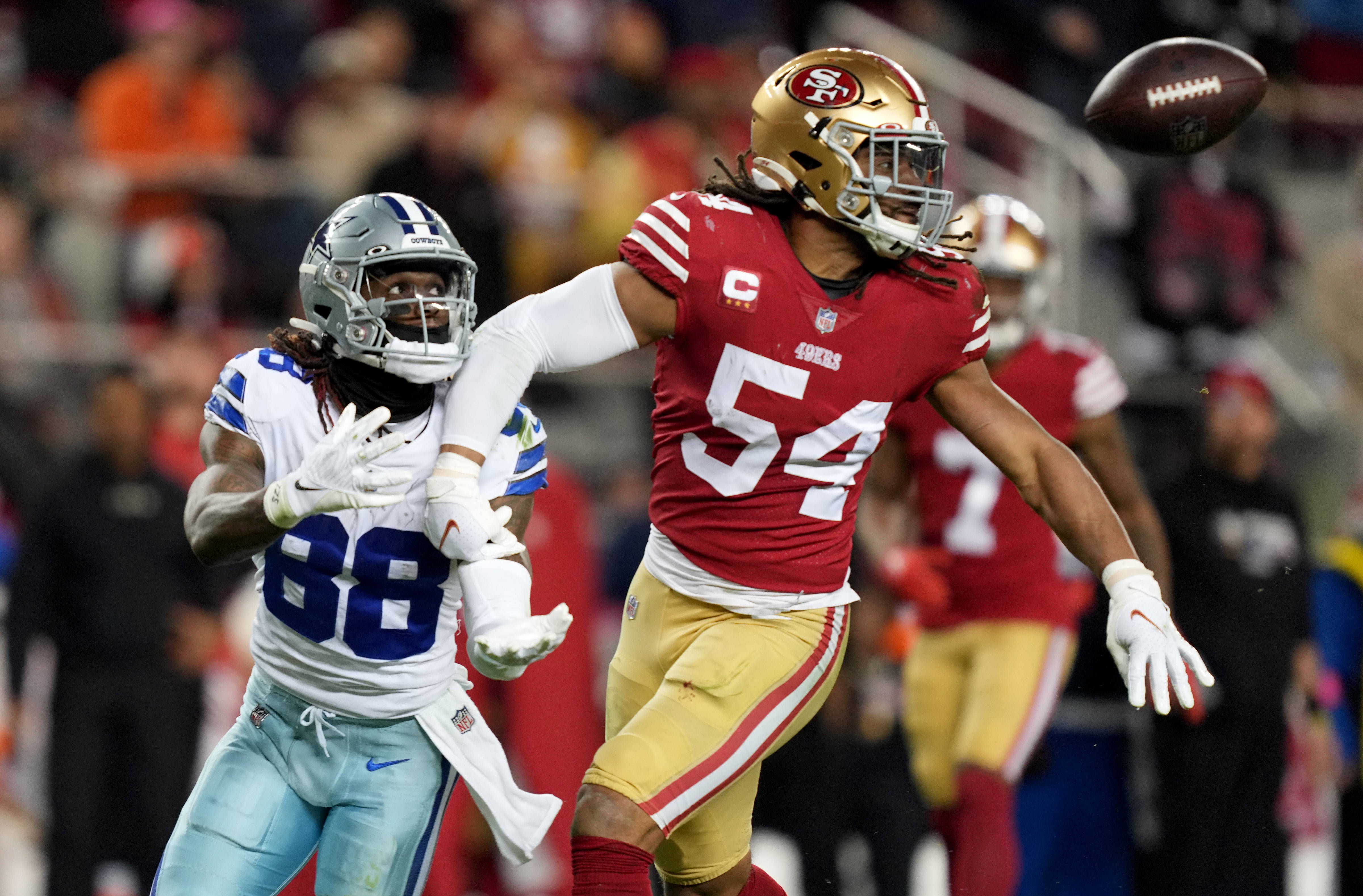Jan 22, 2023; Santa Clara, California, USA; San Francisco 49ers linebacker Fred Warner (54) breaks up a pass intended for Dallas Cowboys wide receiver CeeDee Lamb (88) during the third quarter of a NFC divisional round game at Levi's Stadium.
