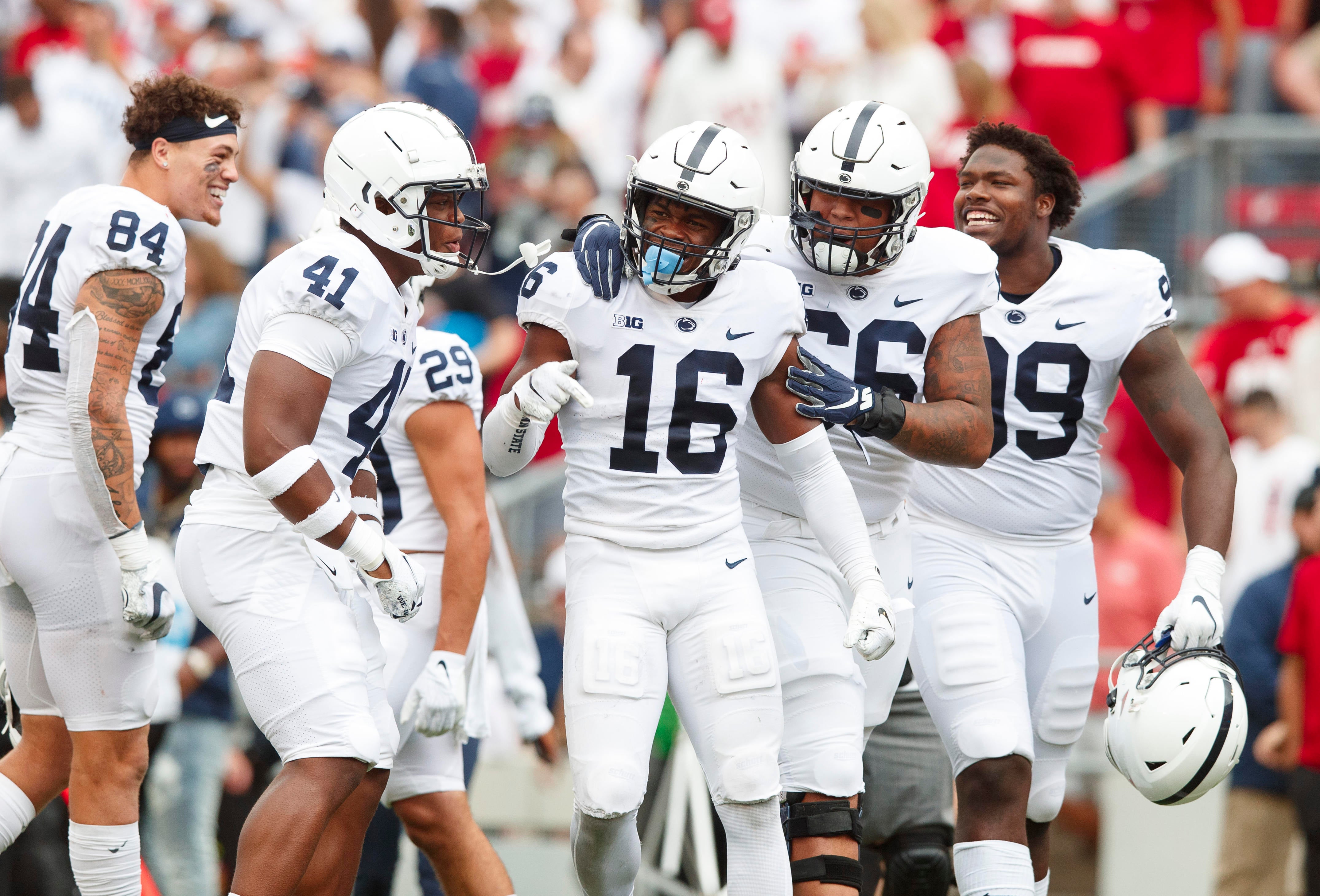 Sep 4, 2021; Madison, Wisconsin, USA; Penn State Nittany Lions safety Ji'Ayir Brown (16) is surrounded by teammates following the game against the Wisconsin Badgers at Camp Randall Stadium. Mandatory Credit: Jeff Hanisch-USA TODAY Sports