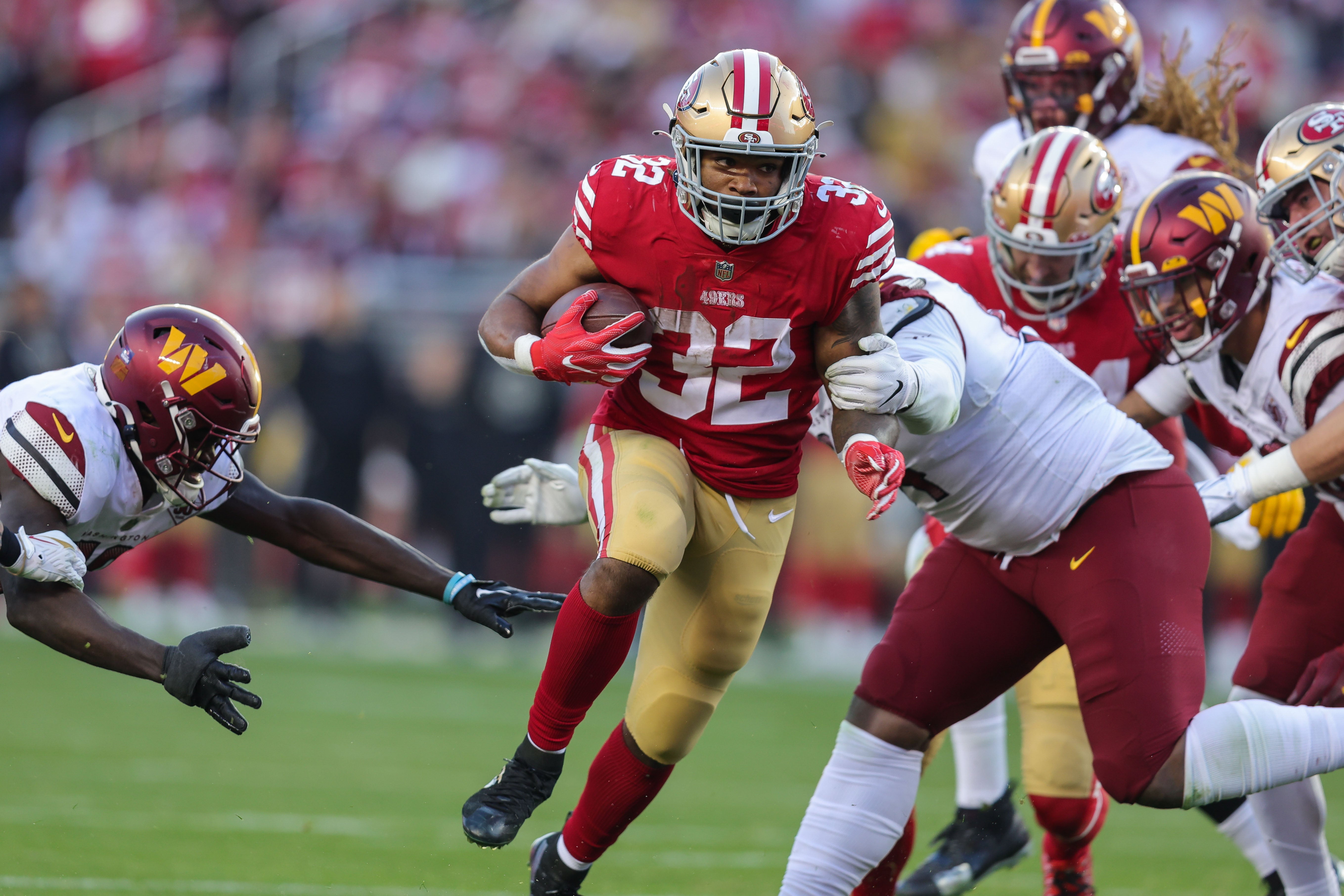 Dec 24, 2022; Santa Clara, California, USA; San Francisco 49ers running back Tyrion Davis-Price (32) runs with the ball during the fourth quarter against the Washington Commanders at Levi's Stadium. Mandatory Credit: Sergio Estrada-USA TODAY Sports