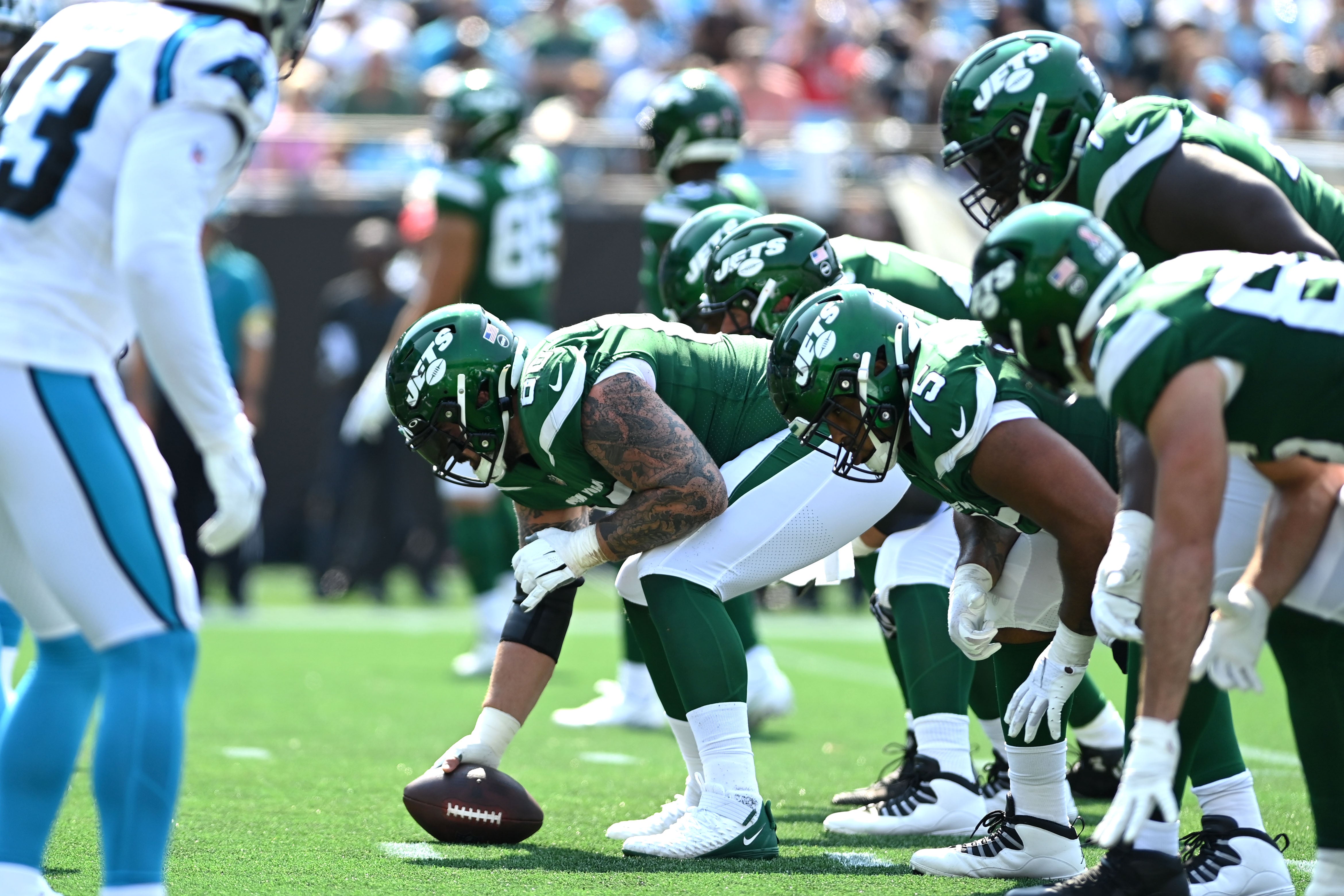 New York Jets at the line of scrimmage in the third quarter at Bank of America Stadium.