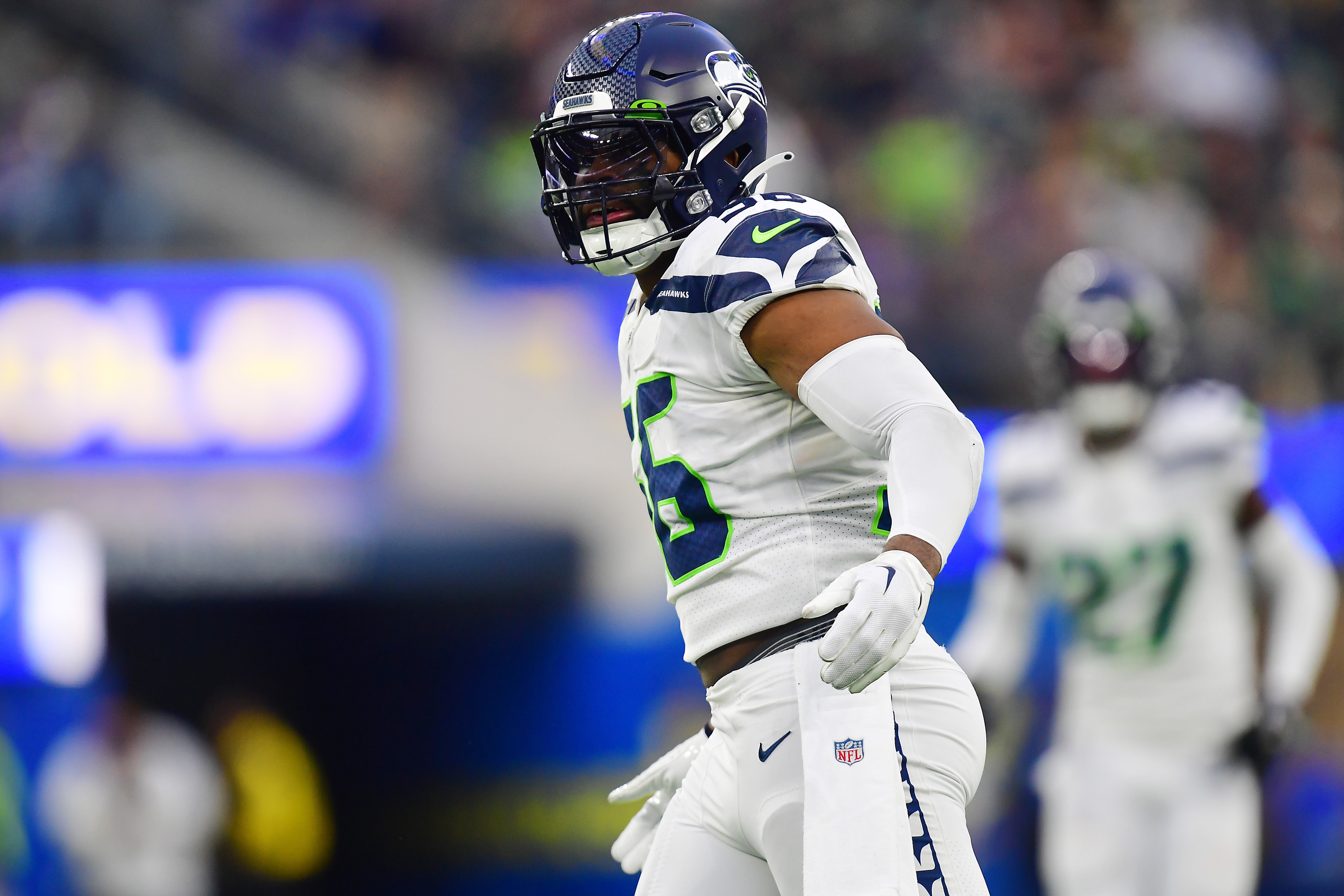 Dec 4, 2022; Inglewood, California, USA; Seattle Seahawks linebacker Jordyn Brooks (56) reacts after sacking Los Angeles Rams quarterback John Wolford (13) during the second half at SoFi Stadium. Mandatory Credit: Gary A. Vasquez-USA TODAY Sports
