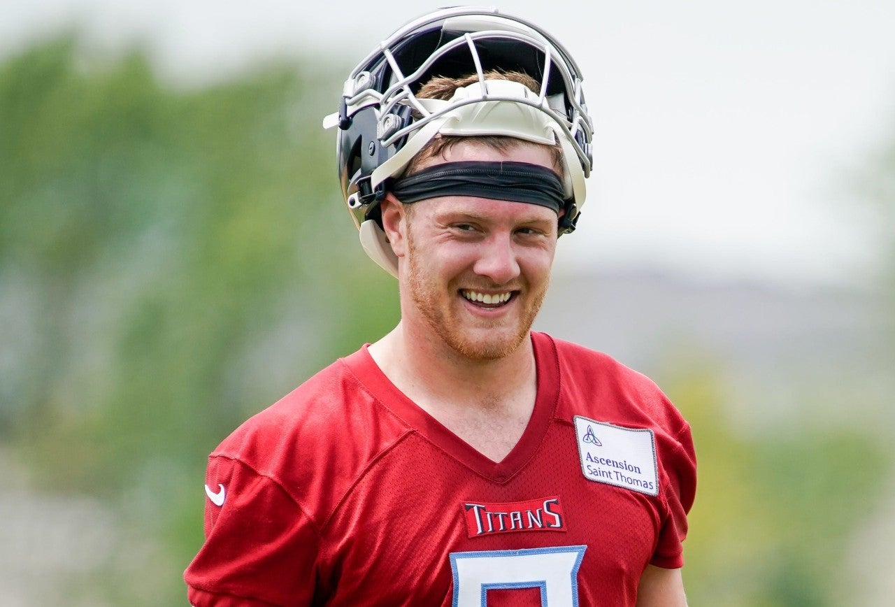 Tennessee Titans quarterback Will Levis (8) smiles while chatting with teammates during an OTA practice at Ascension Saint Thomas Sports Park in Nashville, Tenn., Tuesday, May 23, 2023.
