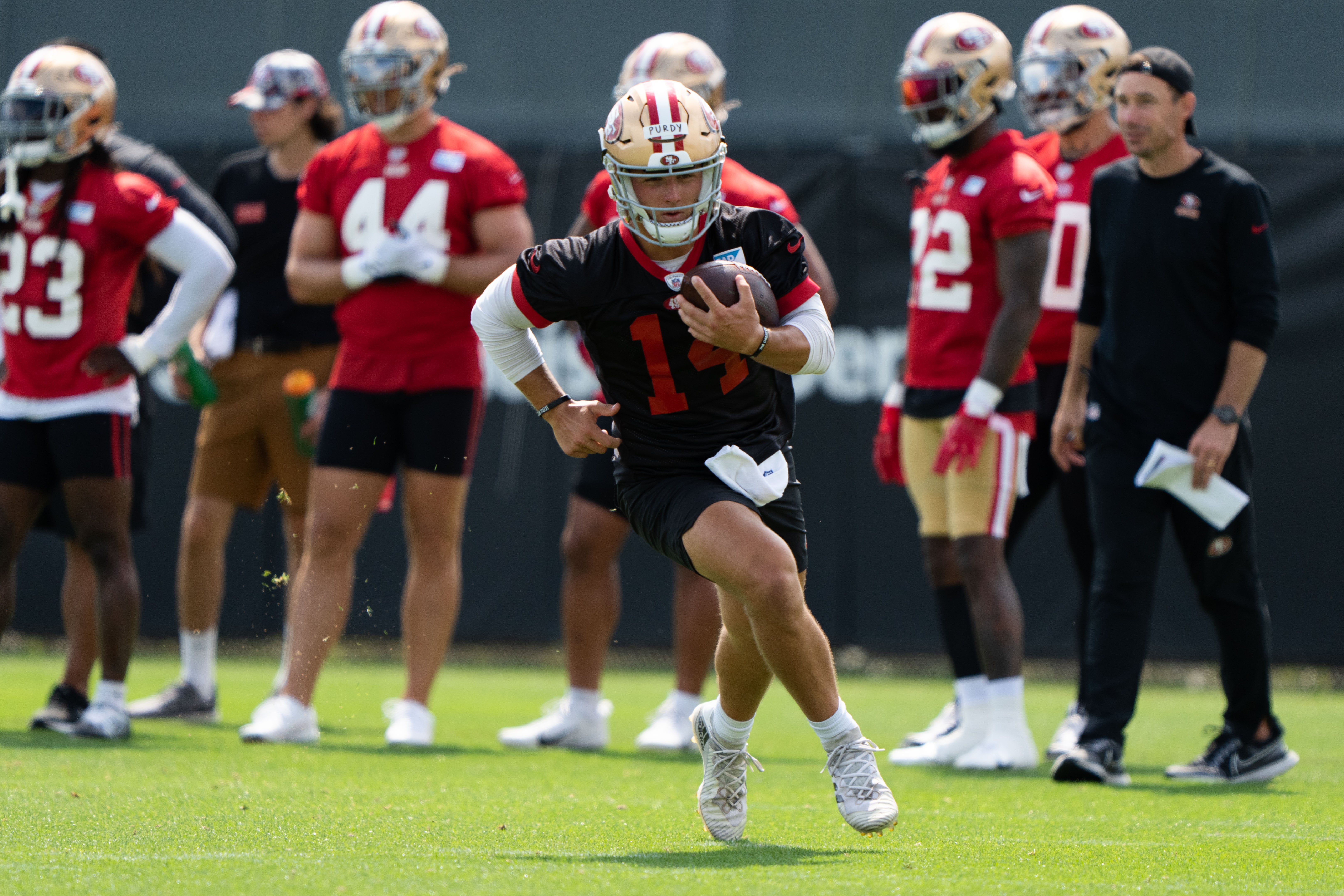Jul 29, 2022; Santa Clara, CA, USA; San Francisco 49ers quarterback Brock Purdy (14) runs during training camp at the SAP Performance Facility near Levi Stadium. Mandatory Credit: Stan Szeto-USA TODAY Sports