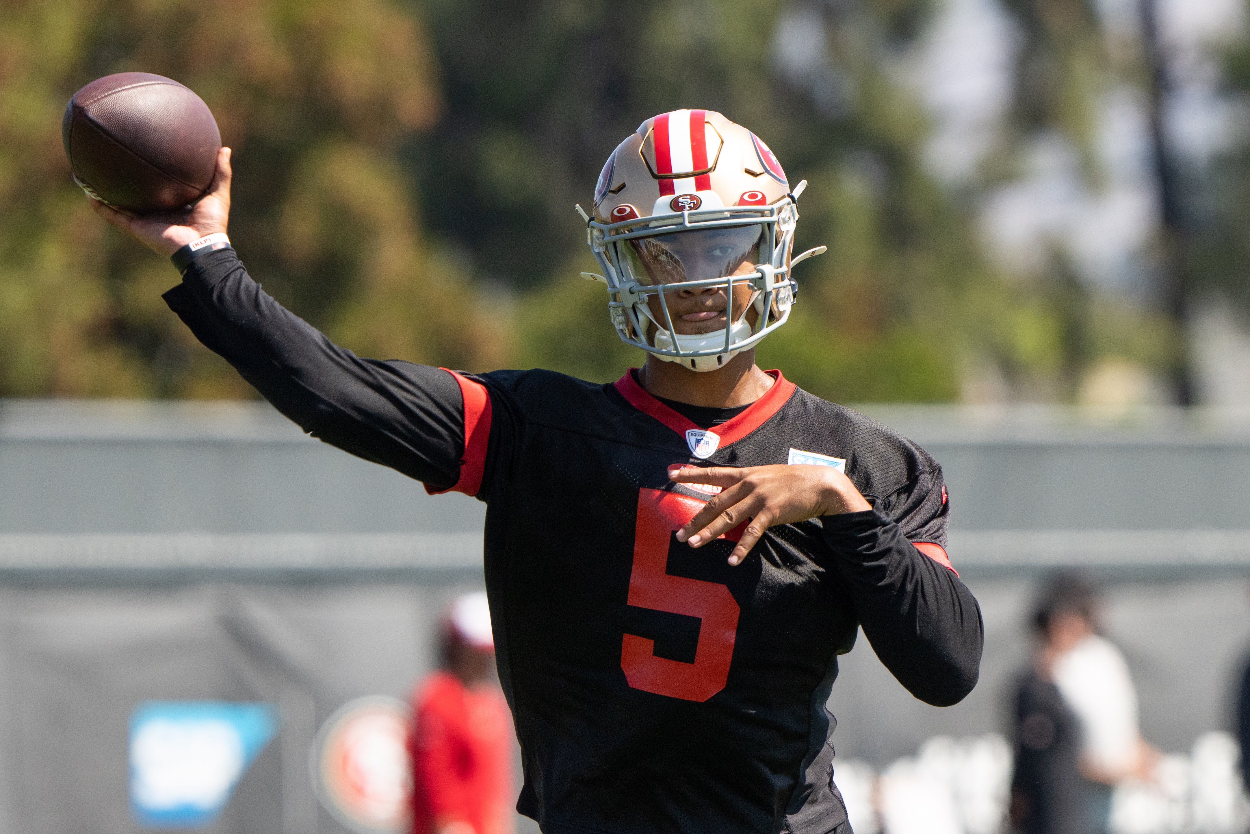 Jul 27, 2022; Santa Clara, CA, USA; San Francisco 49ers quarterback Trey Lance (5) throws the ball during Training Camp at the SAP Performance Facility near Levi Stadium. Mandatory Credit: Stan Szeto-USA TODAY Sports