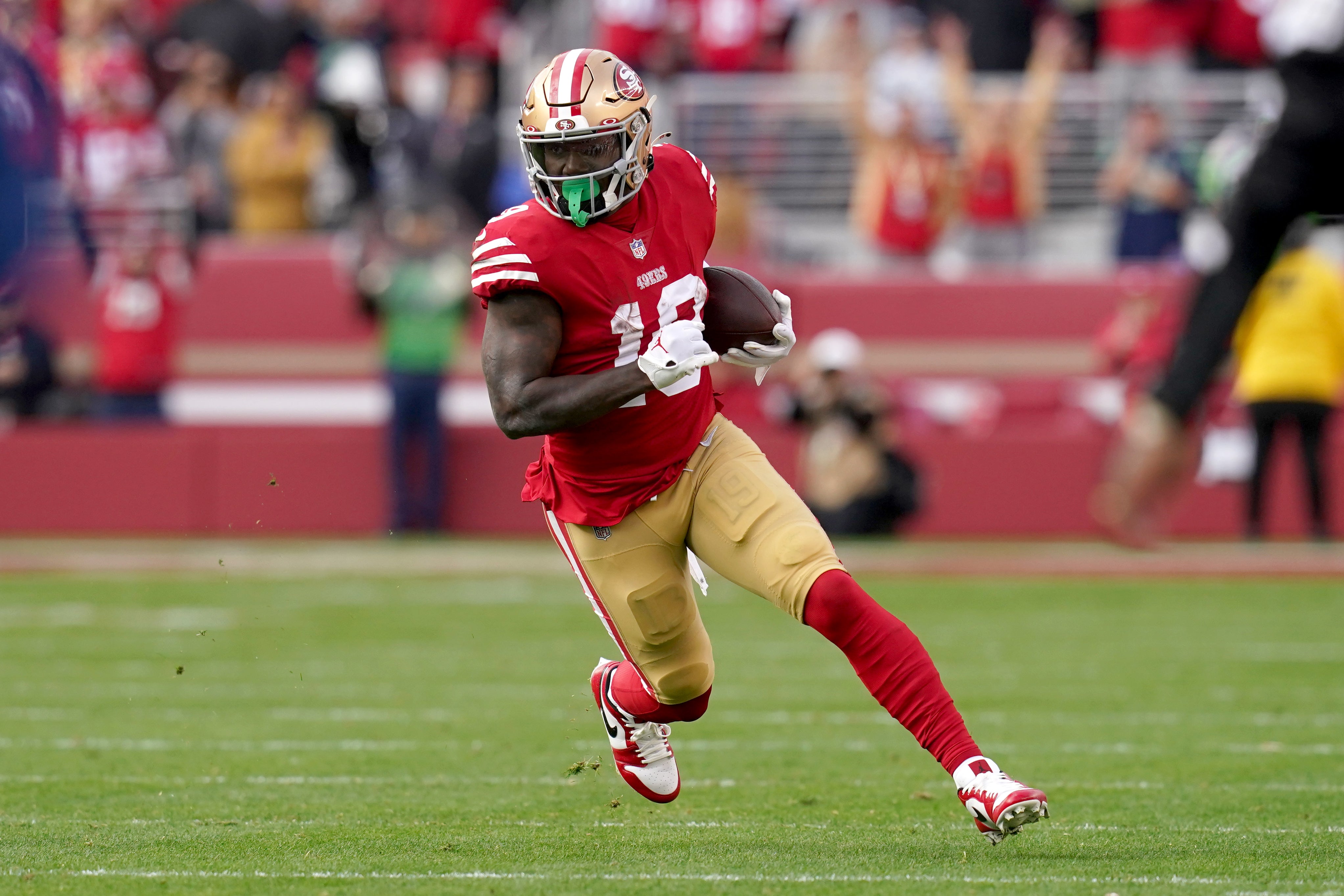 Jan 14, 2023; Santa Clara, California, USA; San Francisco 49ers wide receiver Deebo Samuel (19) runs after a catch in the second quarter of a wild card game against the Seattle Seahawks at Levi's Stadium. Mandatory Credit: Cary Edmondson-USA TODAY Sports