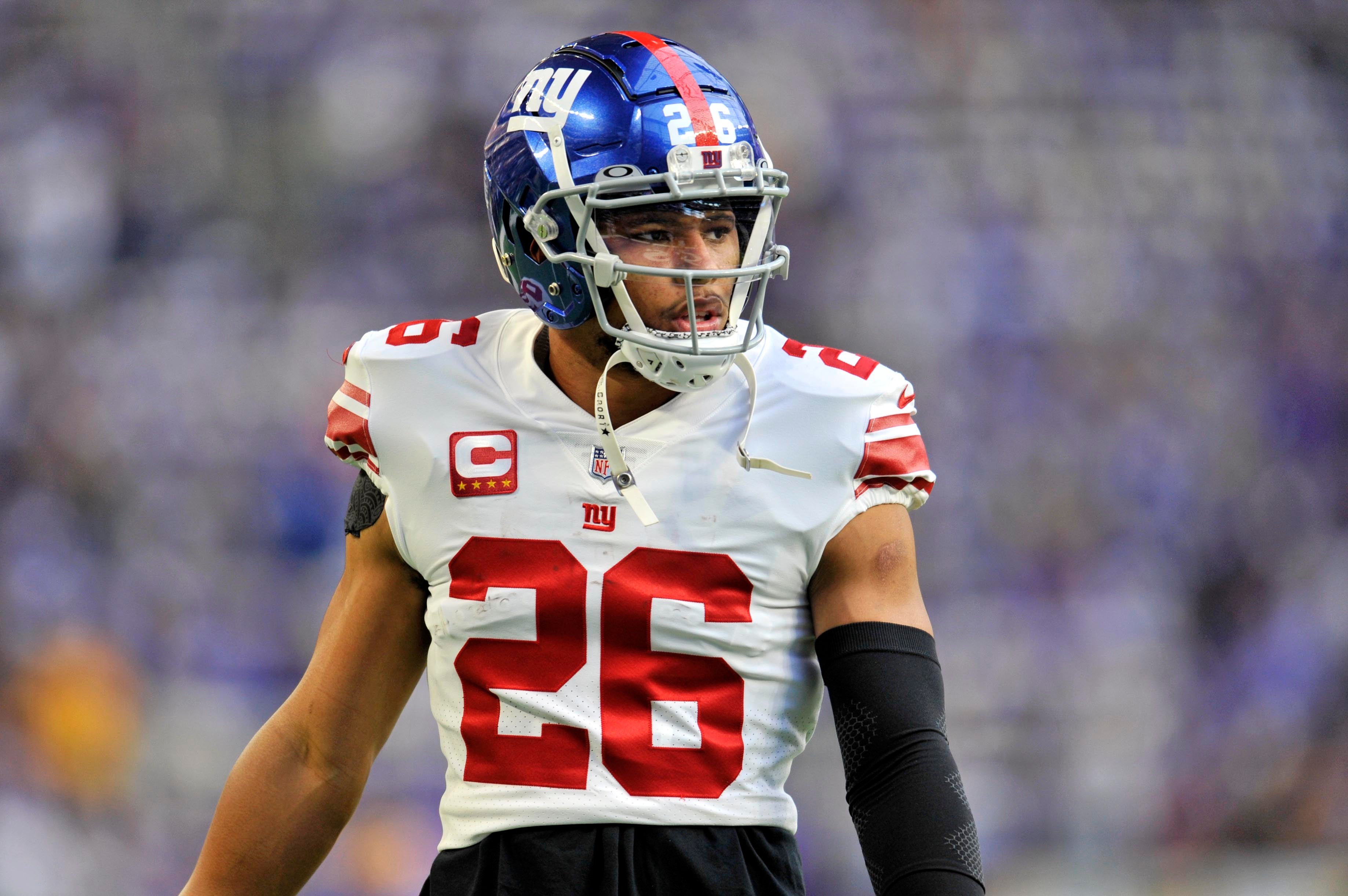 Jan 15, 2023; Minneapolis, Minnesota, USA; New York Giants running back Saquon Barkley (26) looks on during warmups before a wild card game against the Minnesota Vikings at U.S. Bank Stadium.