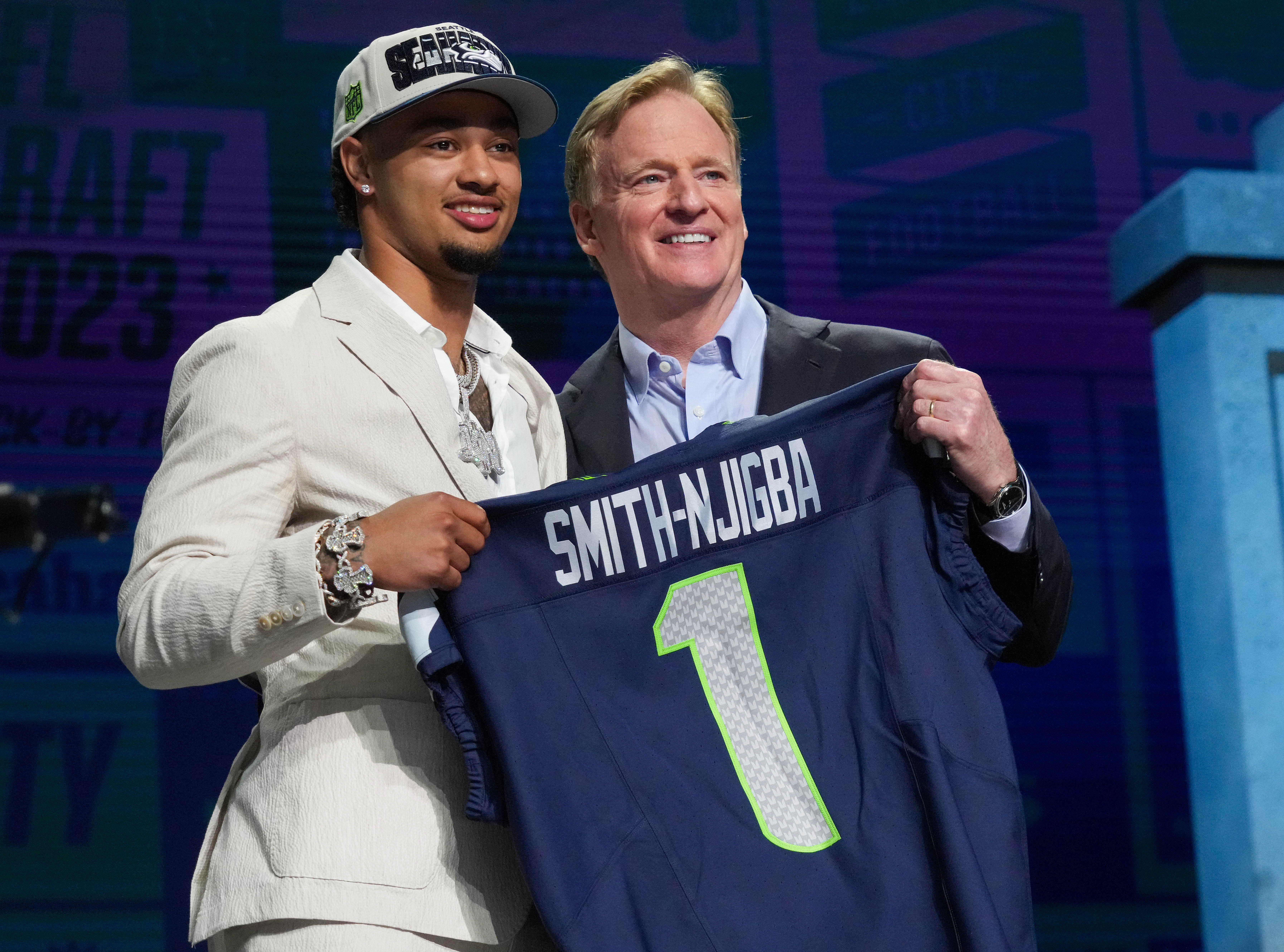 Apr 27, 2023; Kansas City, MO, USA; Ohio State wide receiver Jaxon Smith-Njigba with NFL commissioner Roger Goodell after being selected by the Seattle Seahawks twentieth overall in the first round of the 2023 NFL Draft at Union Station. Mandatory Credit: Kirby Lee-USA TODAY Sports