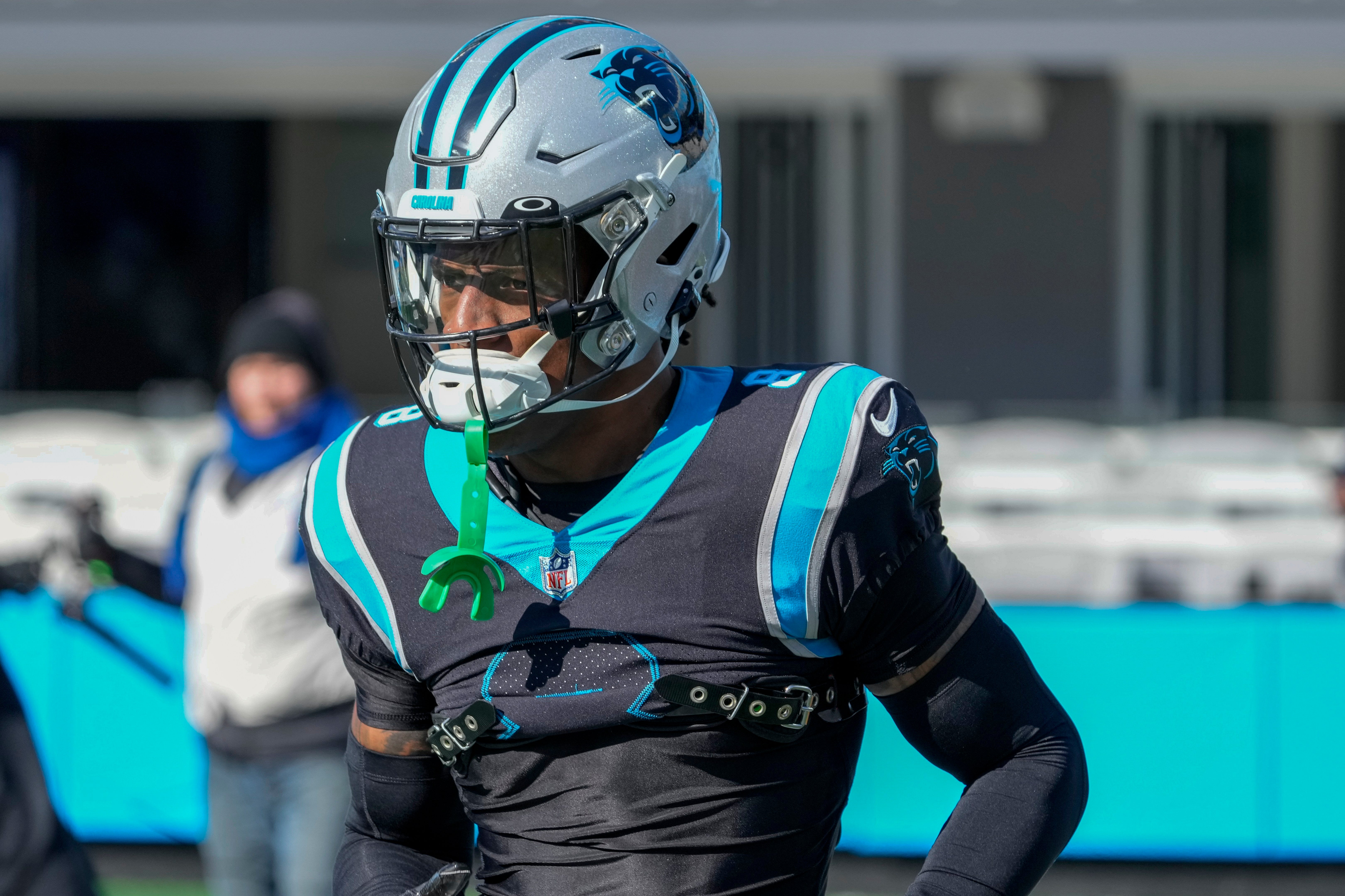Dec 24, 2022; Charlotte, North Carolina, USA; Carolina Panthers cornerback Jaycee Horn (8) runs onto the field during pregame warm ups against the Detroit Lions at Bank of America Stadium.