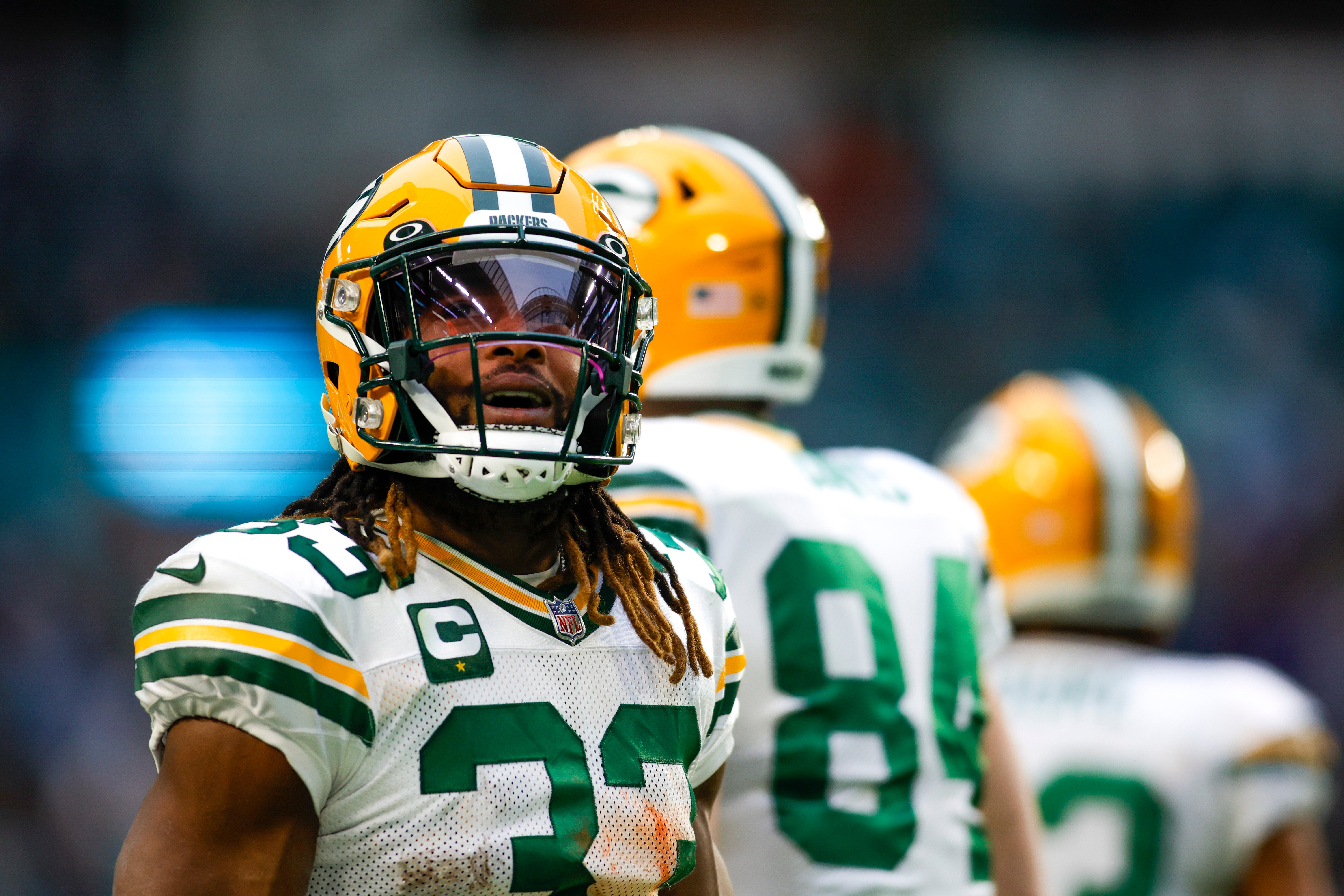 Dec 25, 2022; Miami Gardens, Florida, USA; Green Bay Packers running back Aaron Jones (33) looks on from the field after running with the football during the fourth quarter against the Miami Dolphins at Hard Rock Stadium.