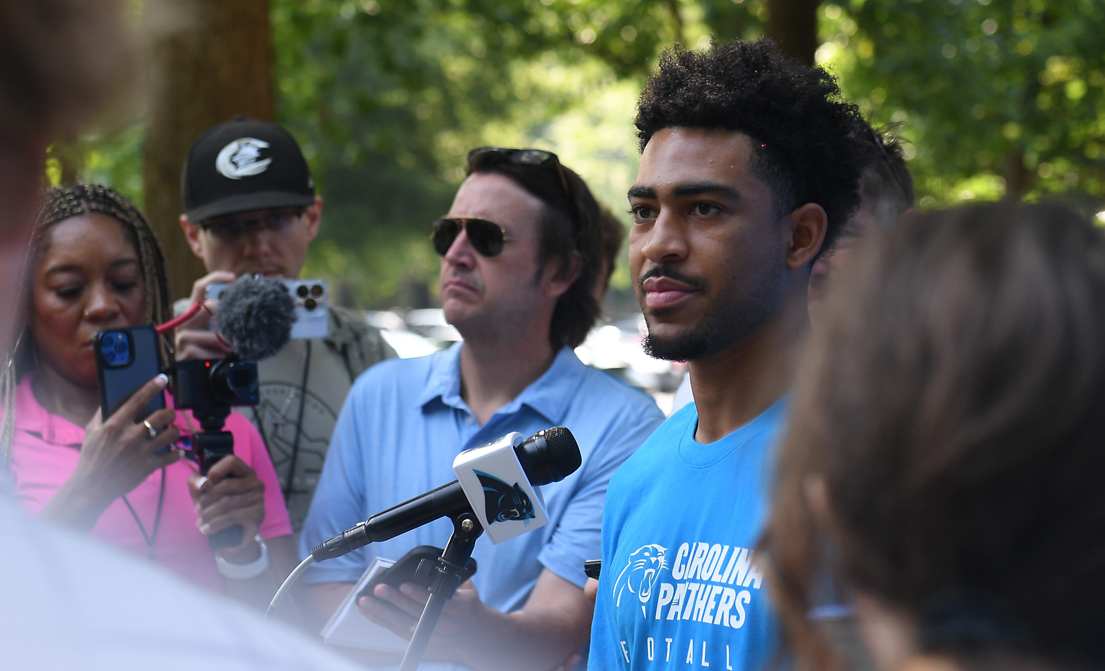 The Carolina Panthers arrived at training camp at Wofford College on Tuesday July 25, 2023. Bryce Young takes a moment to answer questions from the press.