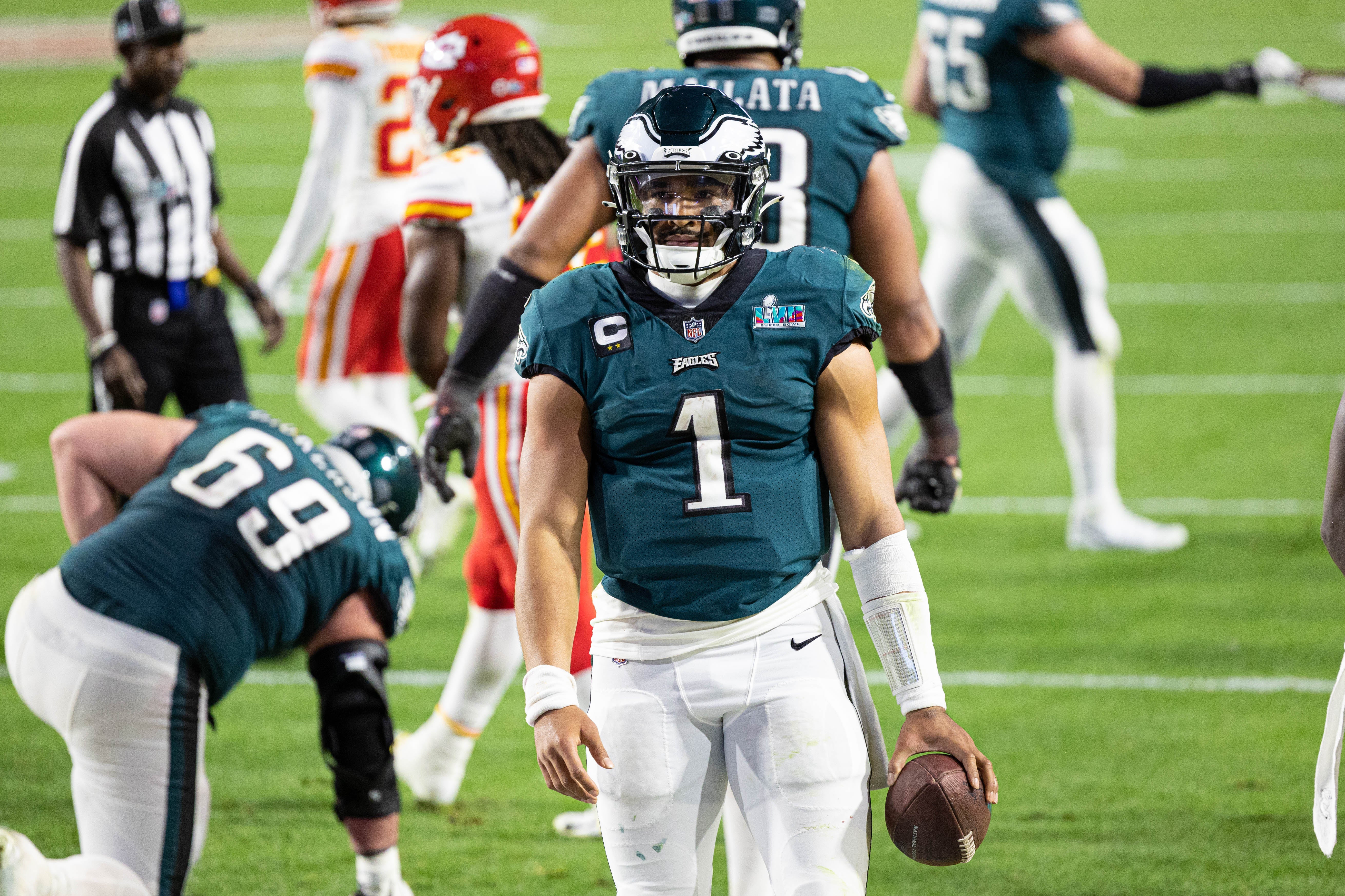 Feb 12, 2023; Glendale, Arizona, US; Philadelphia Eagles quarterback Jalen Hurts (1) reacts after scoring against the Kansas City Chiefs in Super Bowl LVII at State Farm Stadium.