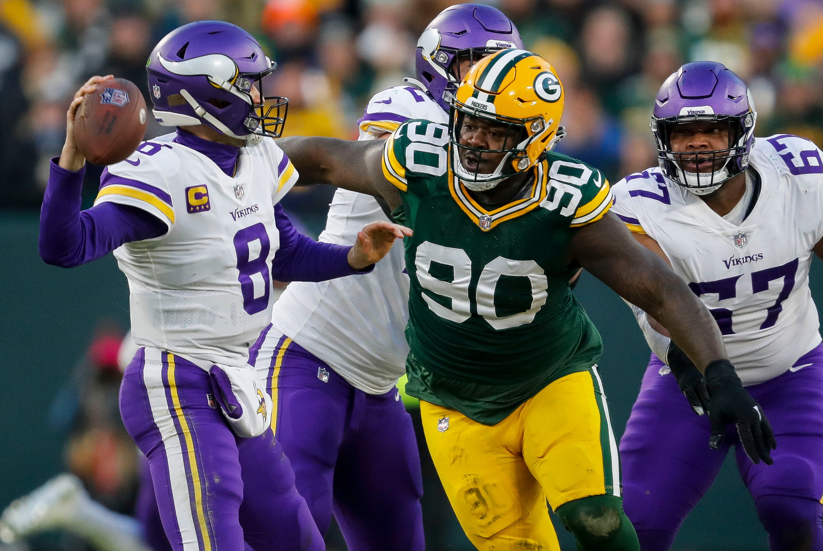 Green Bay Packers defensive tackle Jarran Reed (90) rushes Minnesota Vikings quarterback Kirk Cousins (8) as he passes the ball on Sunday, January 1, 2023, at Lambeau Field in Green Bay, Wis. Tork Mason/USA TODAY NETWORK