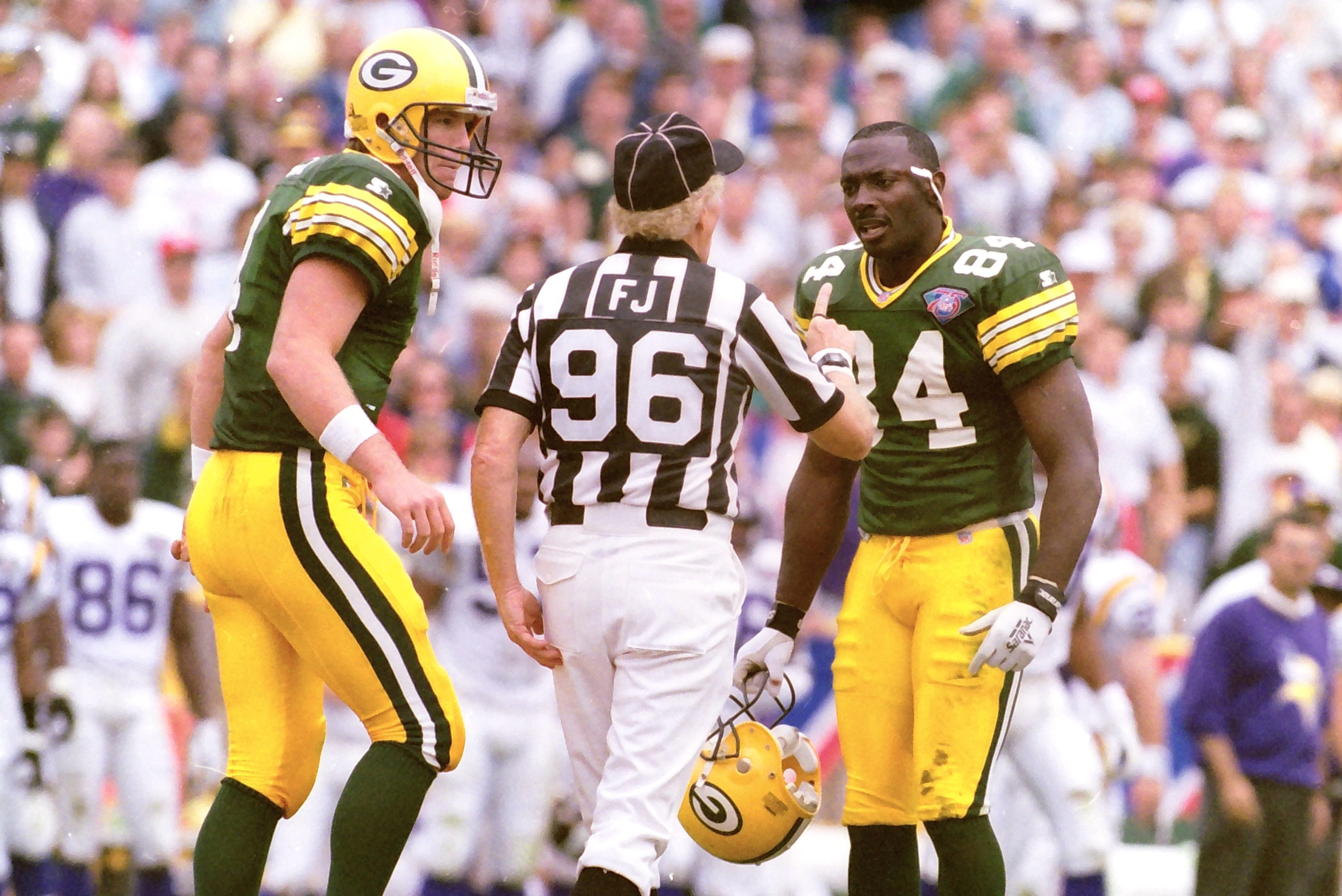 Green Bay Packers quarterback Brett Favre (4) and wide receiver Sterling Sharpe (84) argue with field judge Don Hanks. The Green Bay Packers defeated the Minnesota Vikings 16-10 on Sept. 4, 1994, at Lambeau Field in Green Bay, Wis. Gpg Throwback Packers Vs Vikings