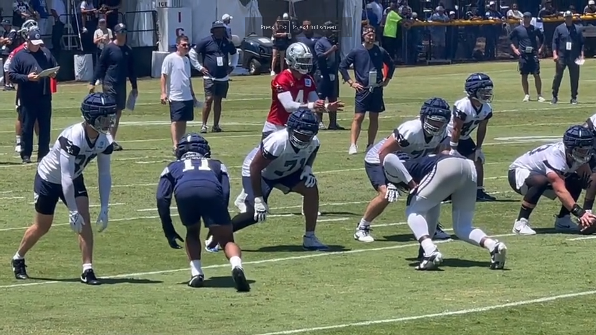 Dallas Cowboys edge rusher Micah Parsons gets ready to rush Dak Prescott in training camp.