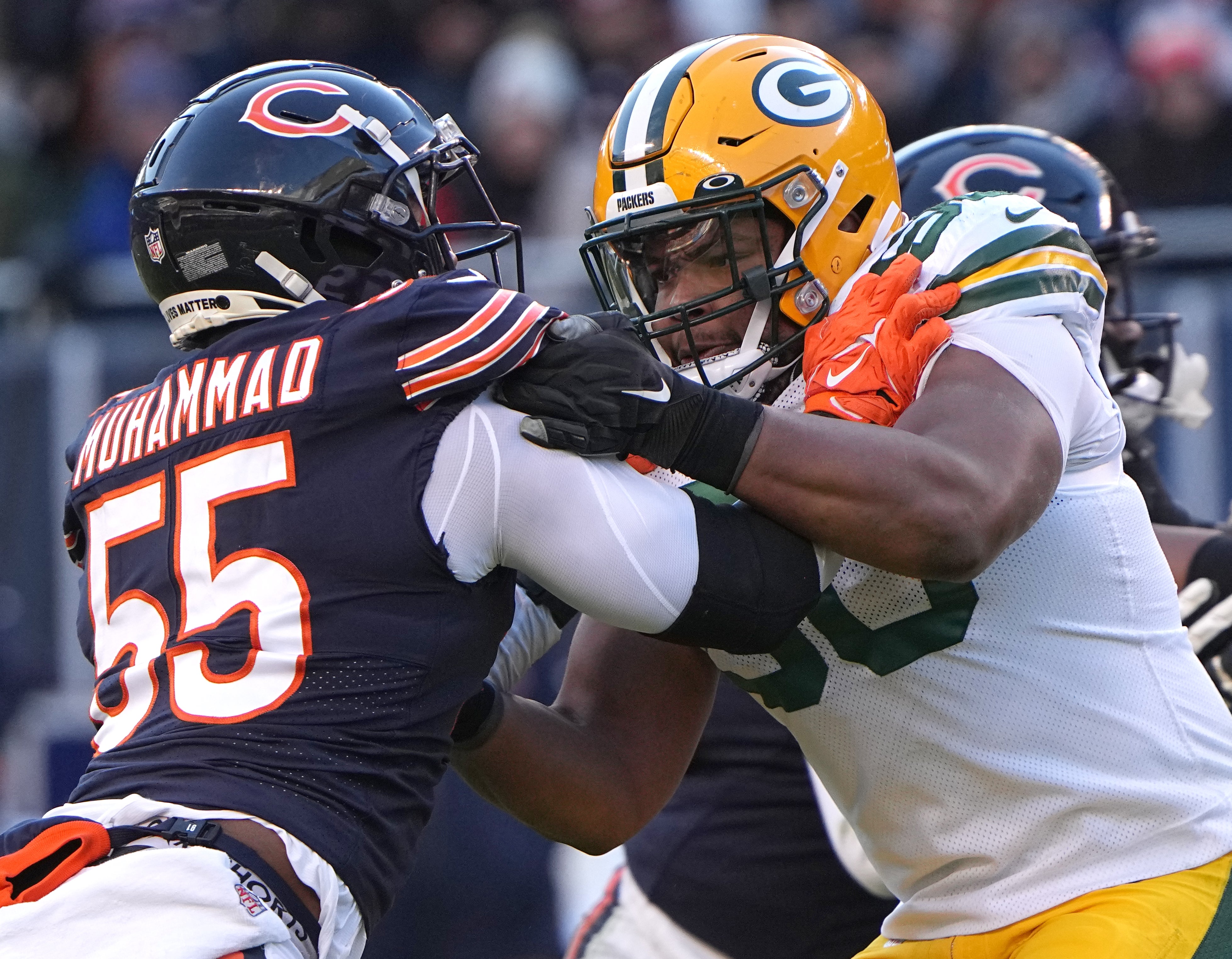 Dec 4, 2022; Chicago, Illinois, USA;Green Bay Packers guard Zach Tom (50) blocks Chicago Bears defensive end Al-Quadin Muhammad (55) during the fourth quarter at Soldier Field.