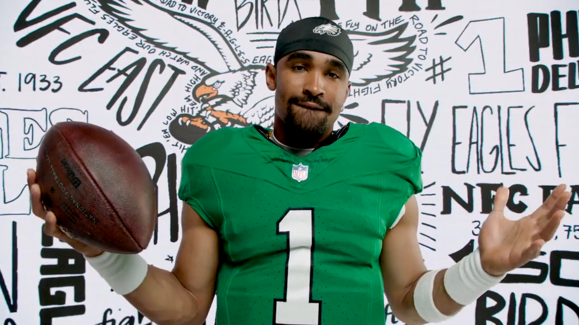 Philadelphia Eagles quarterback Jalen Hurts wearing team's throwback "Kelly Green" jersey.
