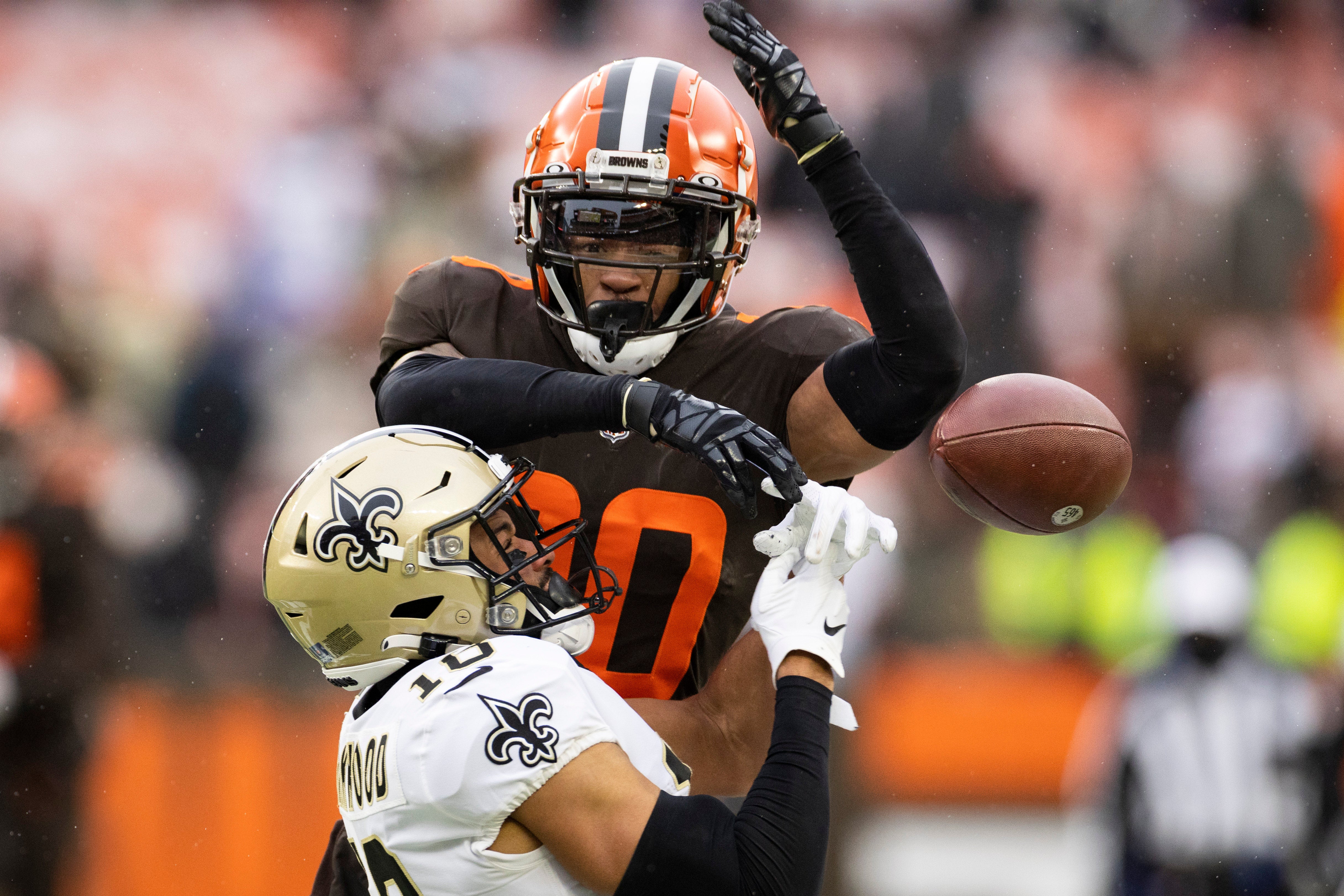 Dec 24, 2022; Cleveland, Ohio, USA; Cleveland Browns cornerback Greg Newsome II (20) breaks up a pass intended from New Orleans Saints wide receiver Keith Kirkwood (18) during the fourth quarter at FirstEnergy Stadium.