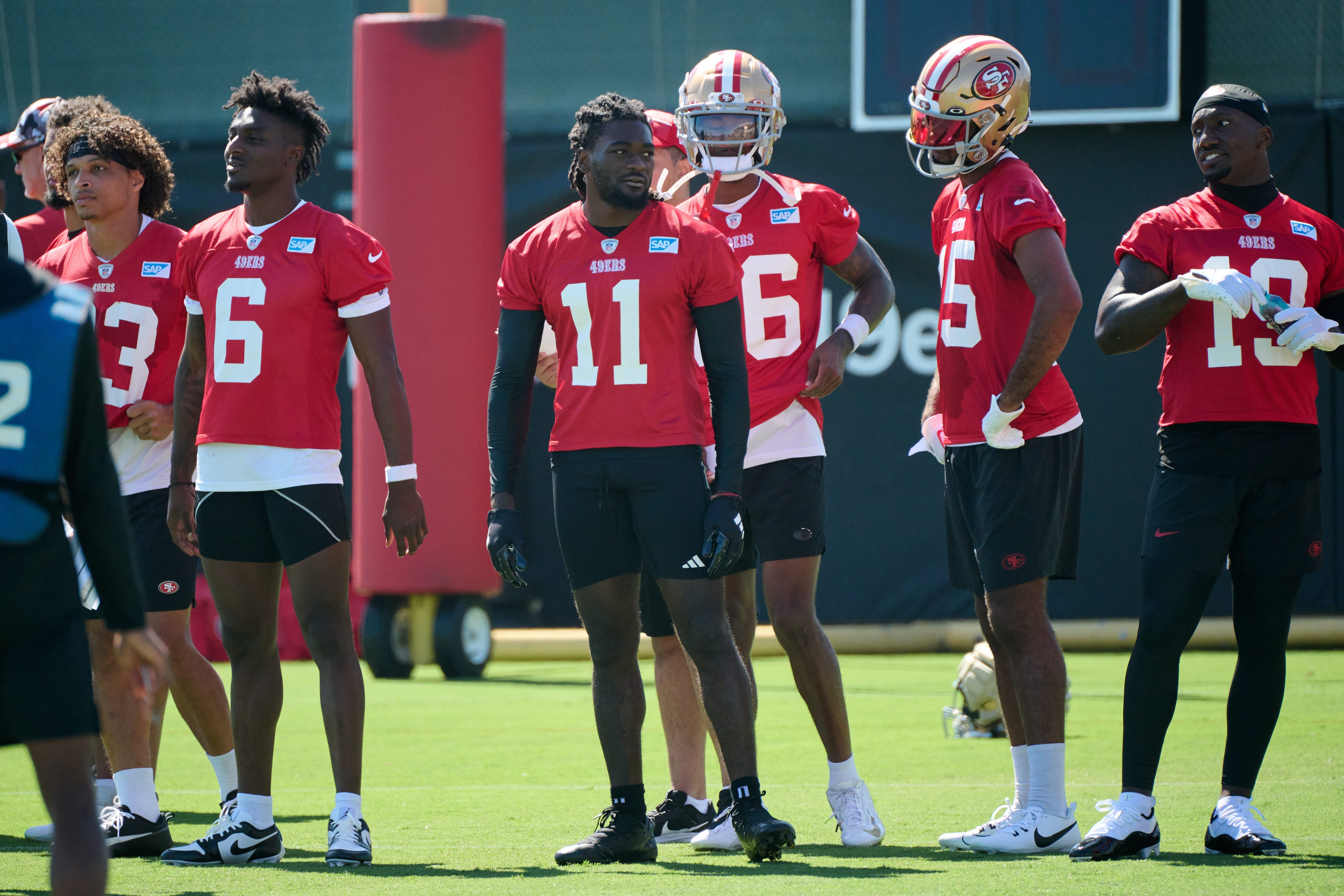 Jul 27, 2023; Santa Clara, CA, USA; San Francisco 49ers wide receiver Brandon Aiyuk (11) stands on the field with his teammates during training camp at the SAP Performance Facility. Mandatory Credit: Robert Edwards-USA TODAY Sports