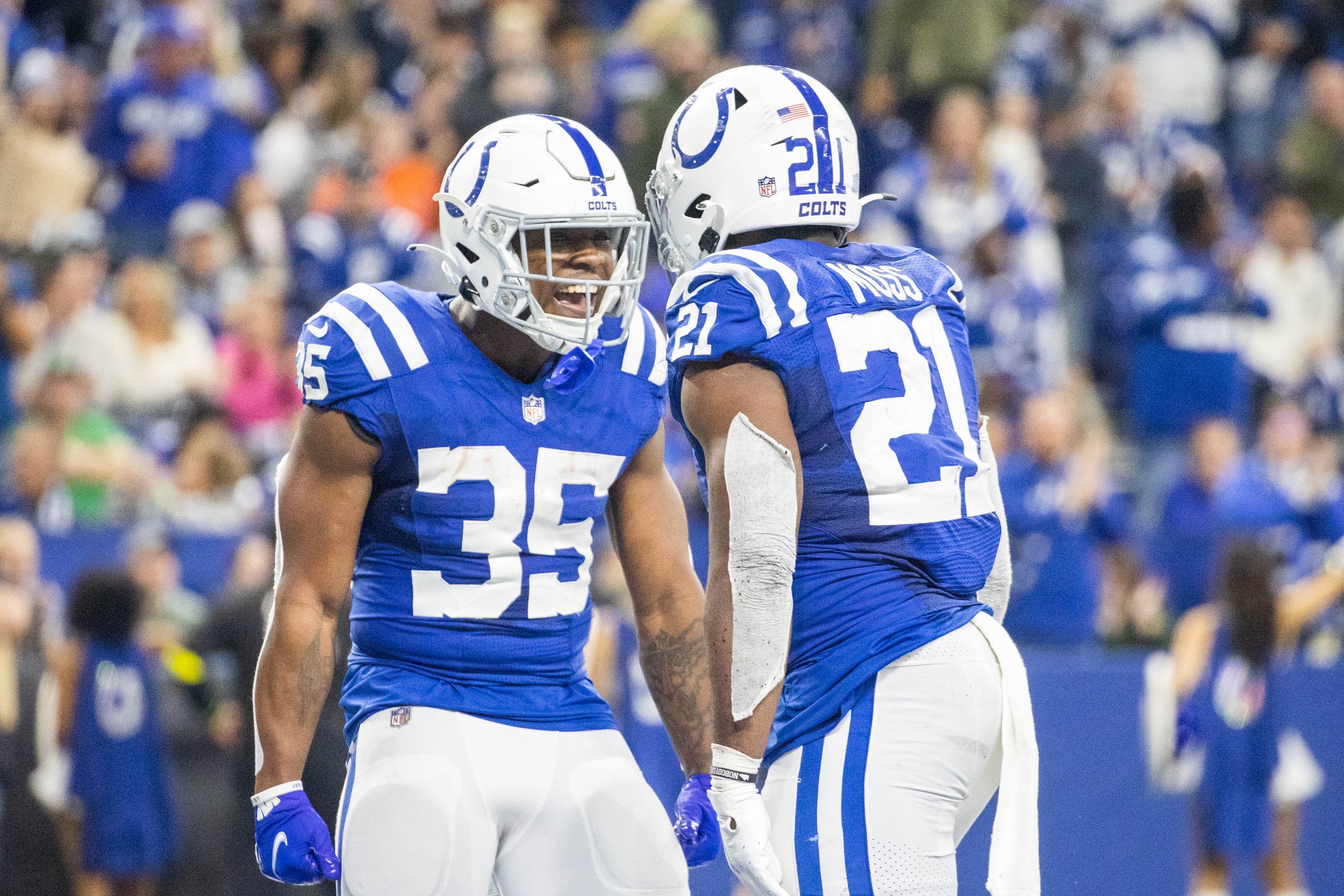Jan 8, 2023; Indianapolis, Indiana, USA; Indianapolis Colts running back Zack Moss (21) celebrates his touchdown with teammates in the third quarter against the Houston Texans at Lucas Oil Stadium.