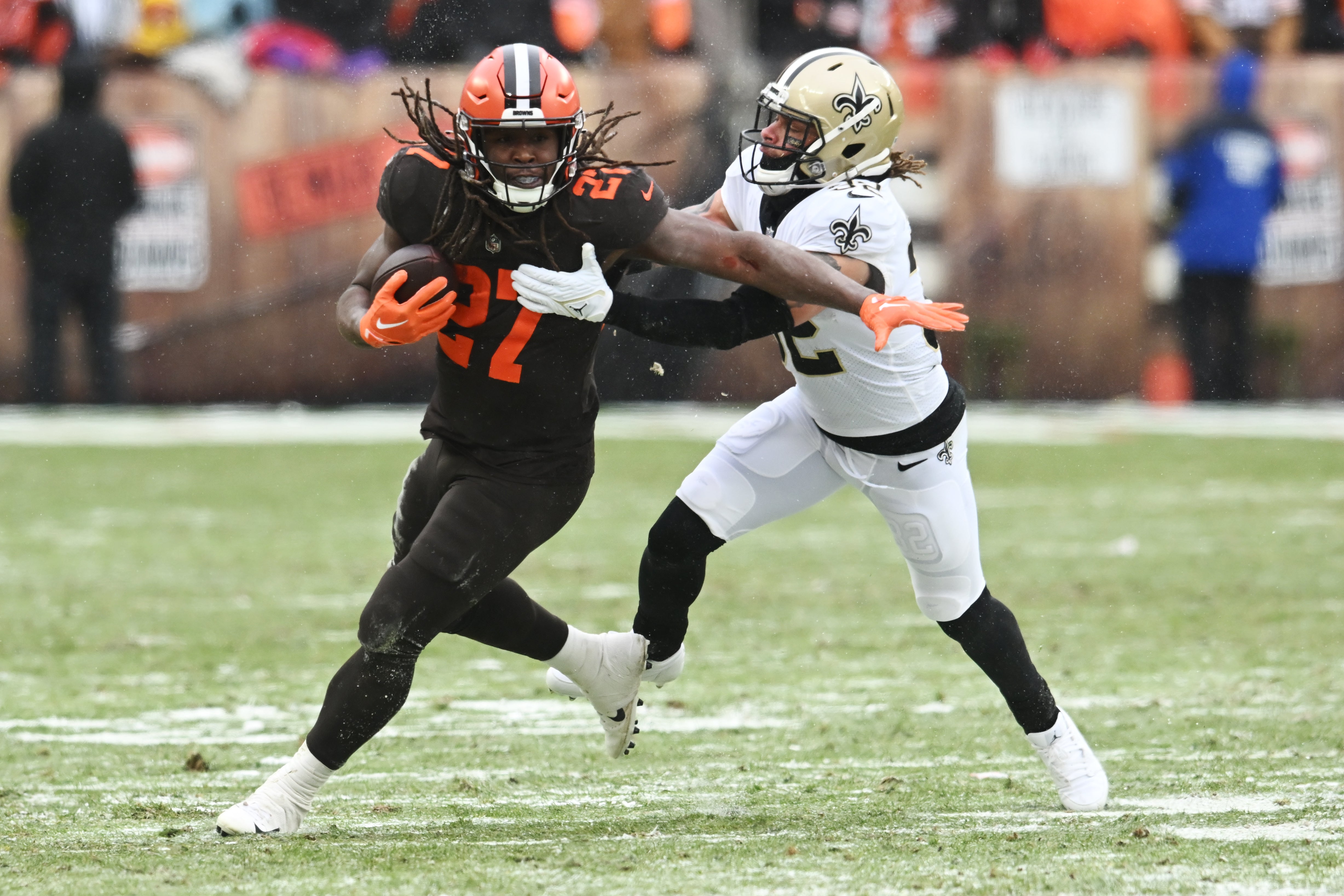 Dec 24, 2022; Cleveland, Ohio, USA; New Orleans Saints safety Tyrann Mathieu (32) tackles Cleveland Browns running back Kareem Hunt (27) during the first half at FirstEnergy Stadium.