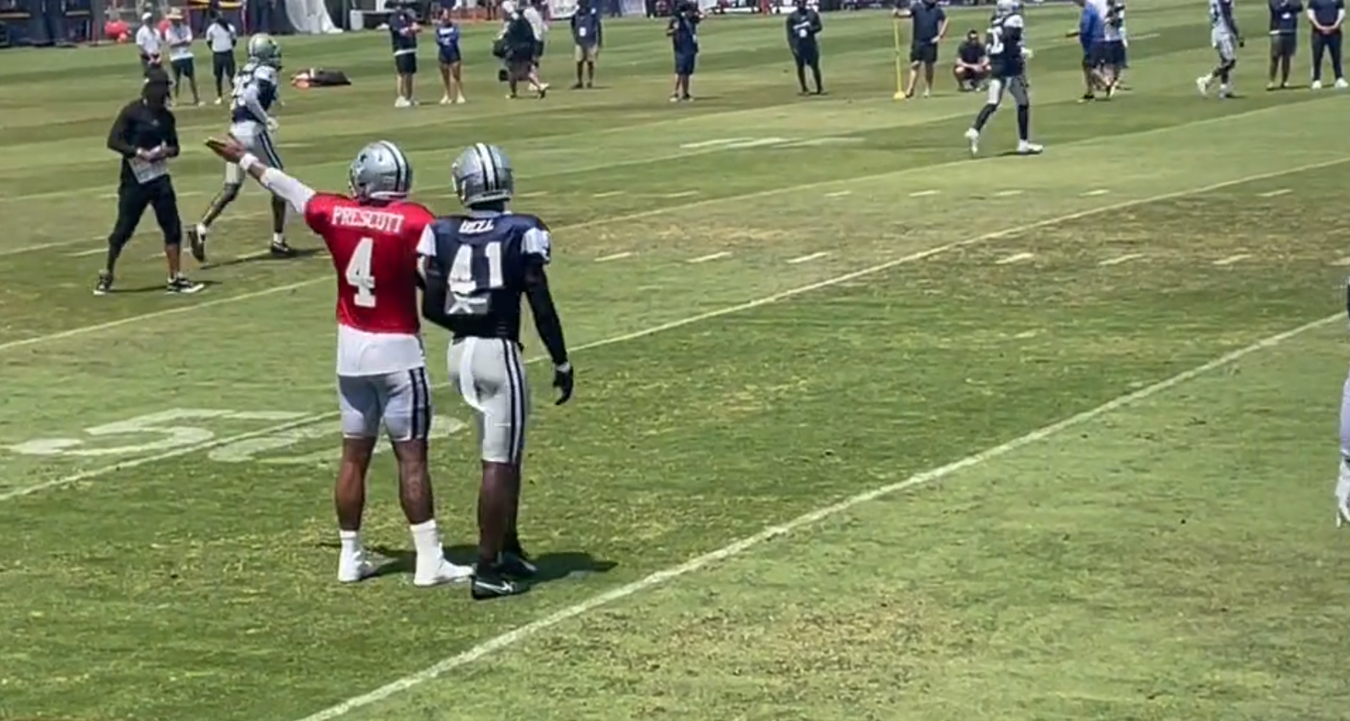 Dallas Cowboys quarterback Dak Prescott trash talks defense after two plays in training camp.