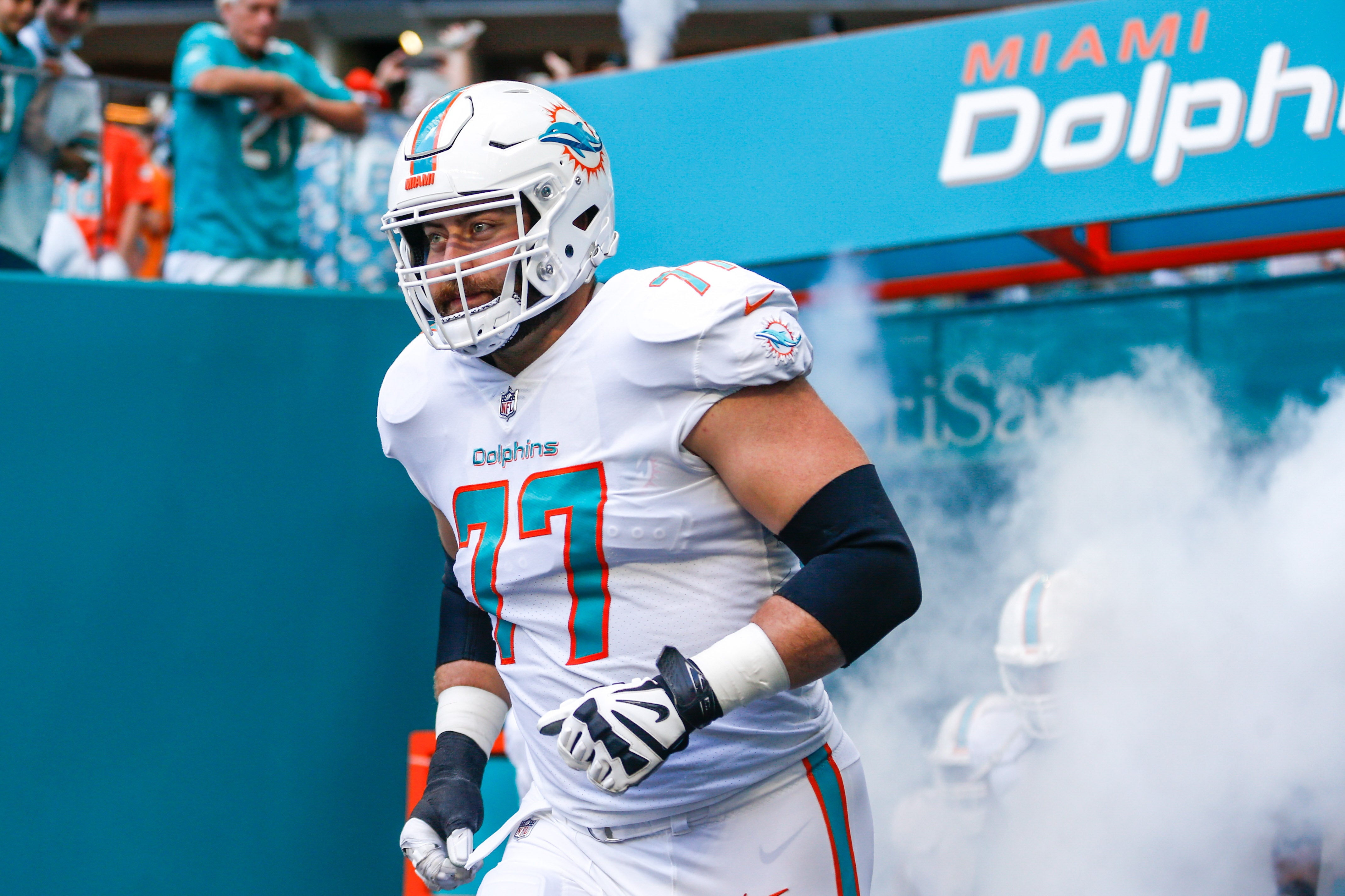 Dec 5, 2021; Miami Gardens, Florida, USA; Miami Dolphins offensive tackle Jesse Davis (77) takes on the field prior the game against the New York Giants at Hard Rock Stadium.
