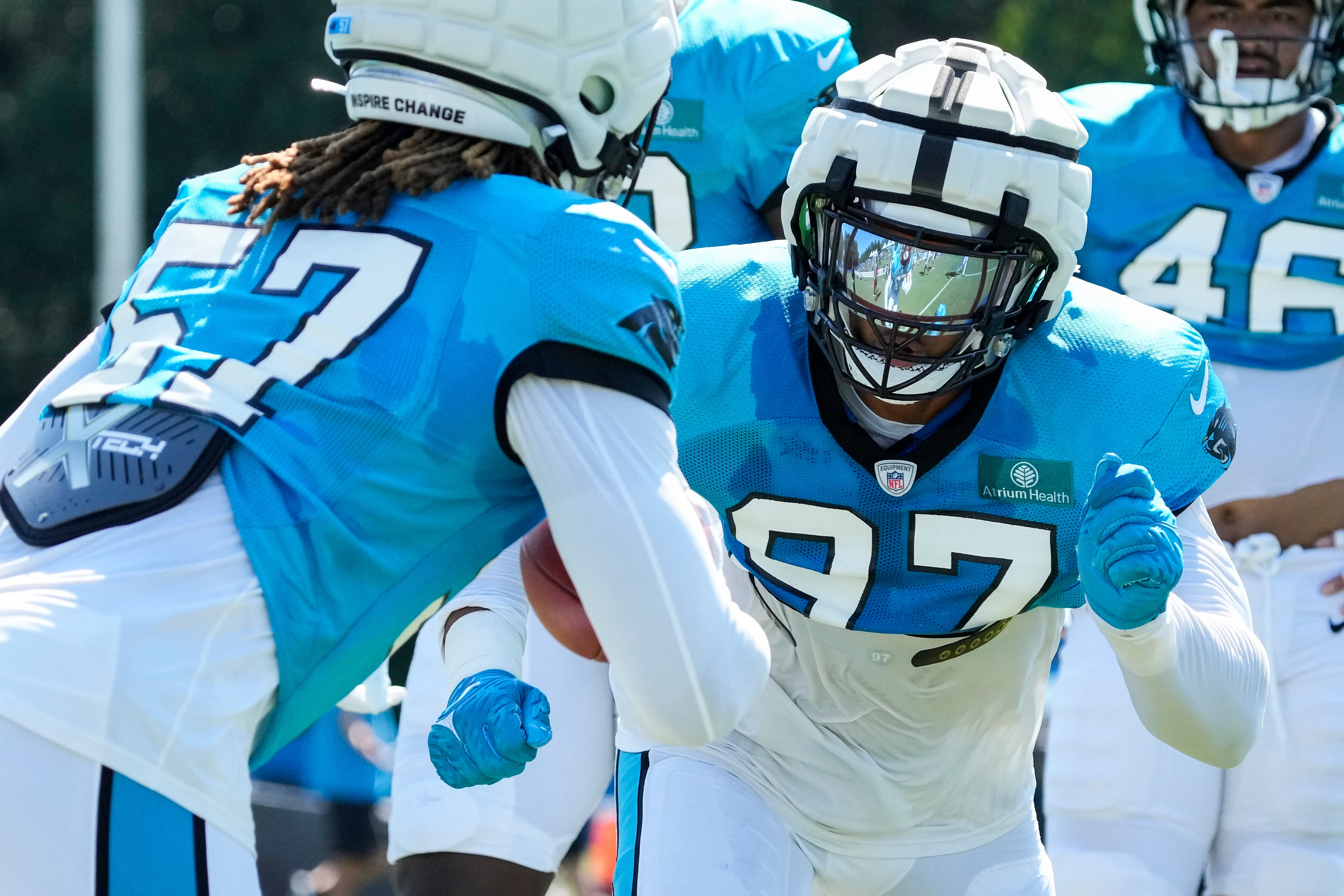Jul 31, 2023; Spartanburg, SC, USA; Carolina Panthers defensive end Yetur Gross-Matos (97) in a drill against linebacker Arron Mosby (57) during training camp at Wofford College.