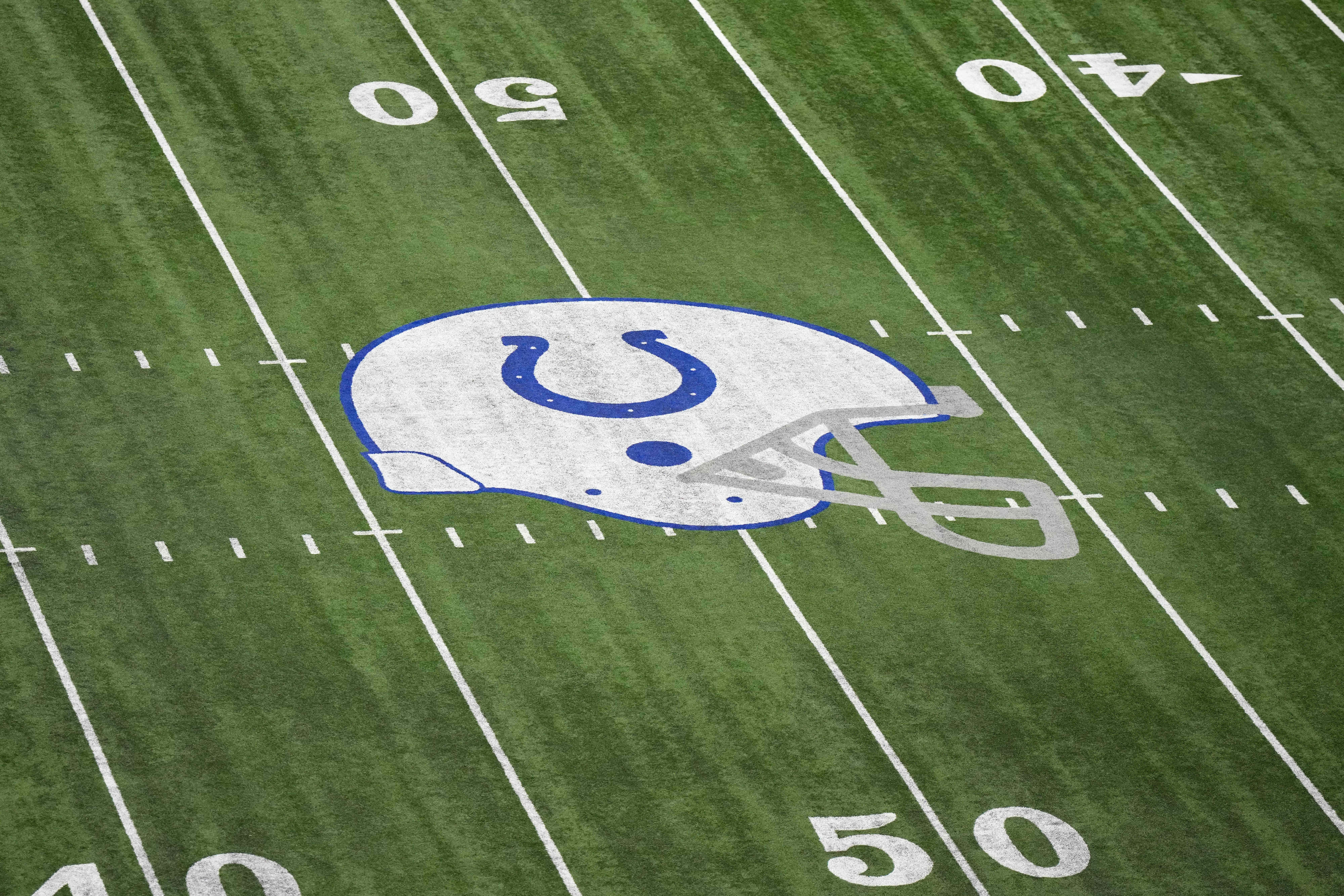 Mar 3, 2023; Indianapolis, IN, USA; The Indianapolis Colts helmet logo at midfield at Lucas Oil Stadium.