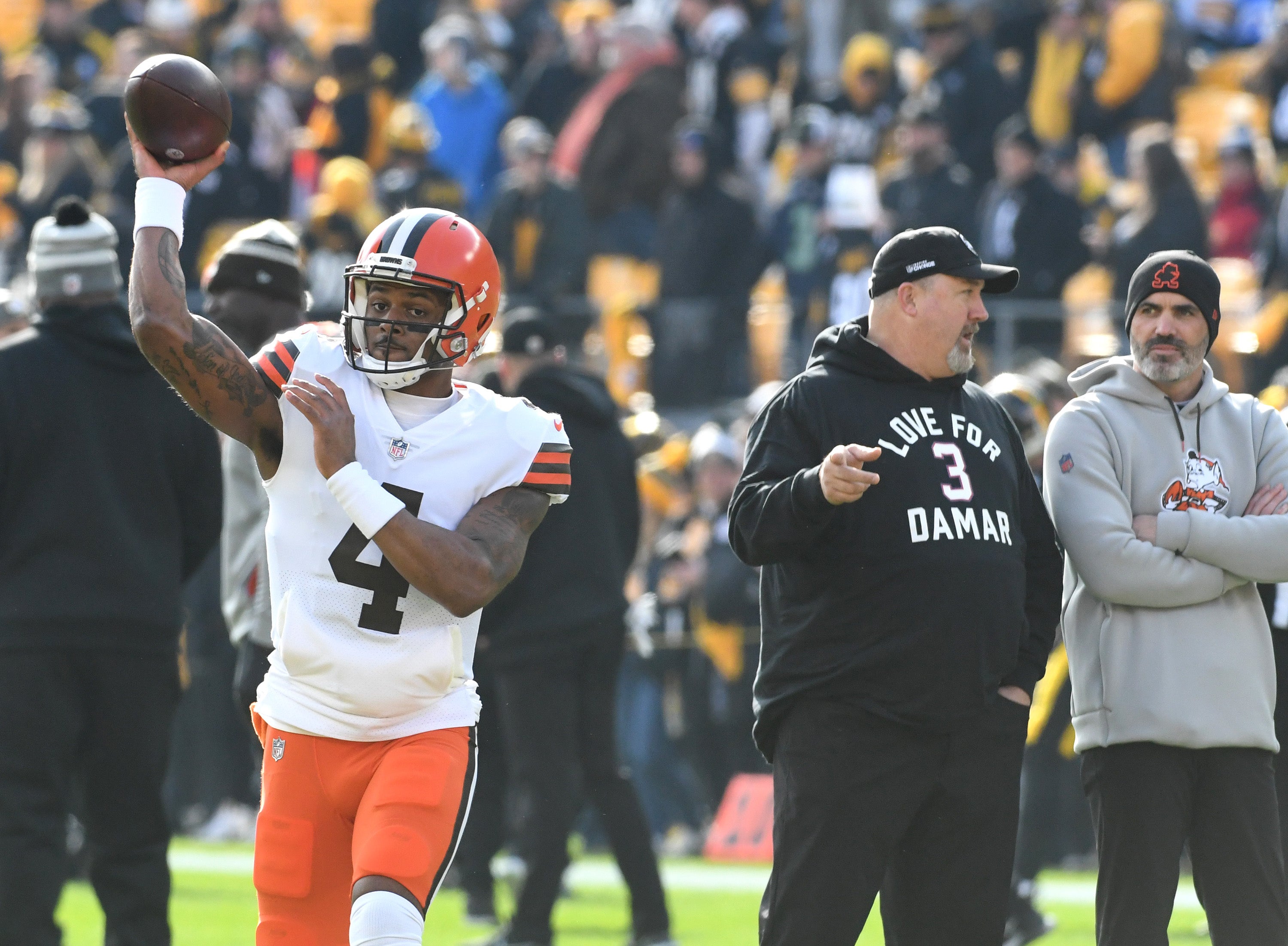 Jan 8, 2023; Pittsburgh, Pennsylvania, USA; Cleveland Browns quarterback Deshaun Watson (4) throws a practice pass as head coach Kevin Stefanski (right) watches before playing the Pittsburgh Steelers at Acrisure Stadium.