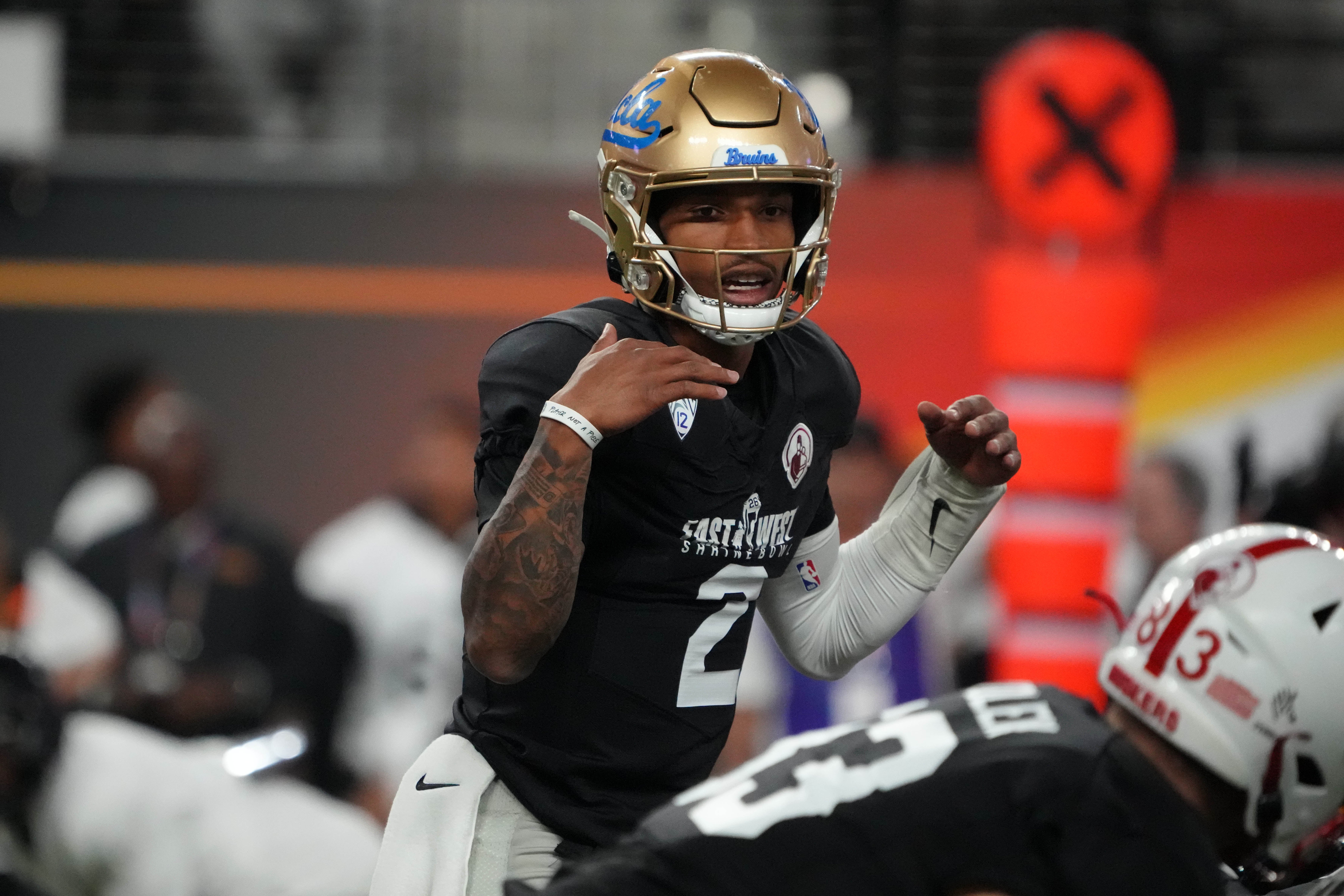 Feb 2, 2023; Las Vegas, NV, USA; West quarterback Dorian Thompson-Robinson of UCLA (2) prepares to take the snap against the East during the Shrine Bowl at Allegiant Stadium.