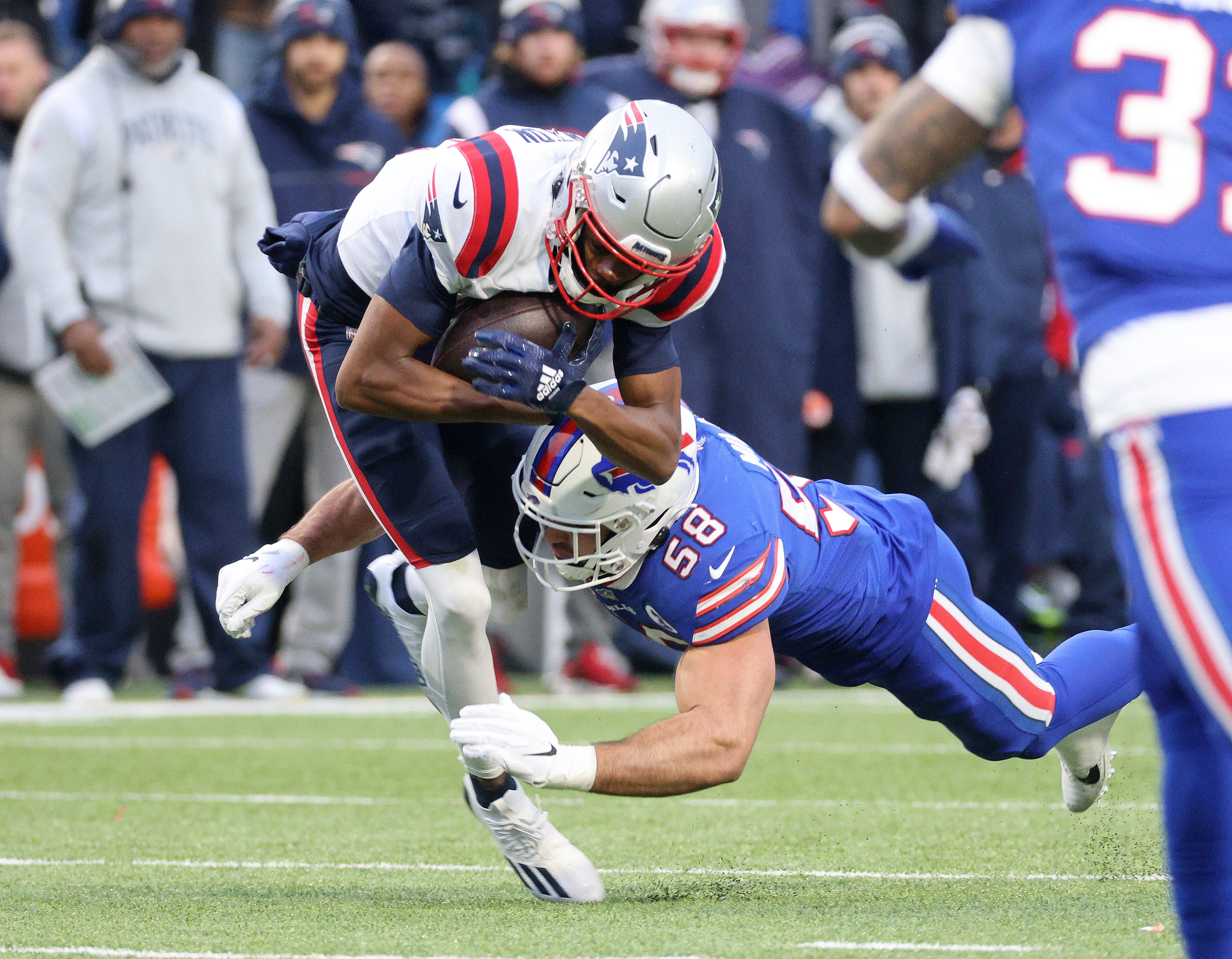 Patriots receiver Tyquan Thornton is tackled by Bills linebacker Matt Milano after a catch.
