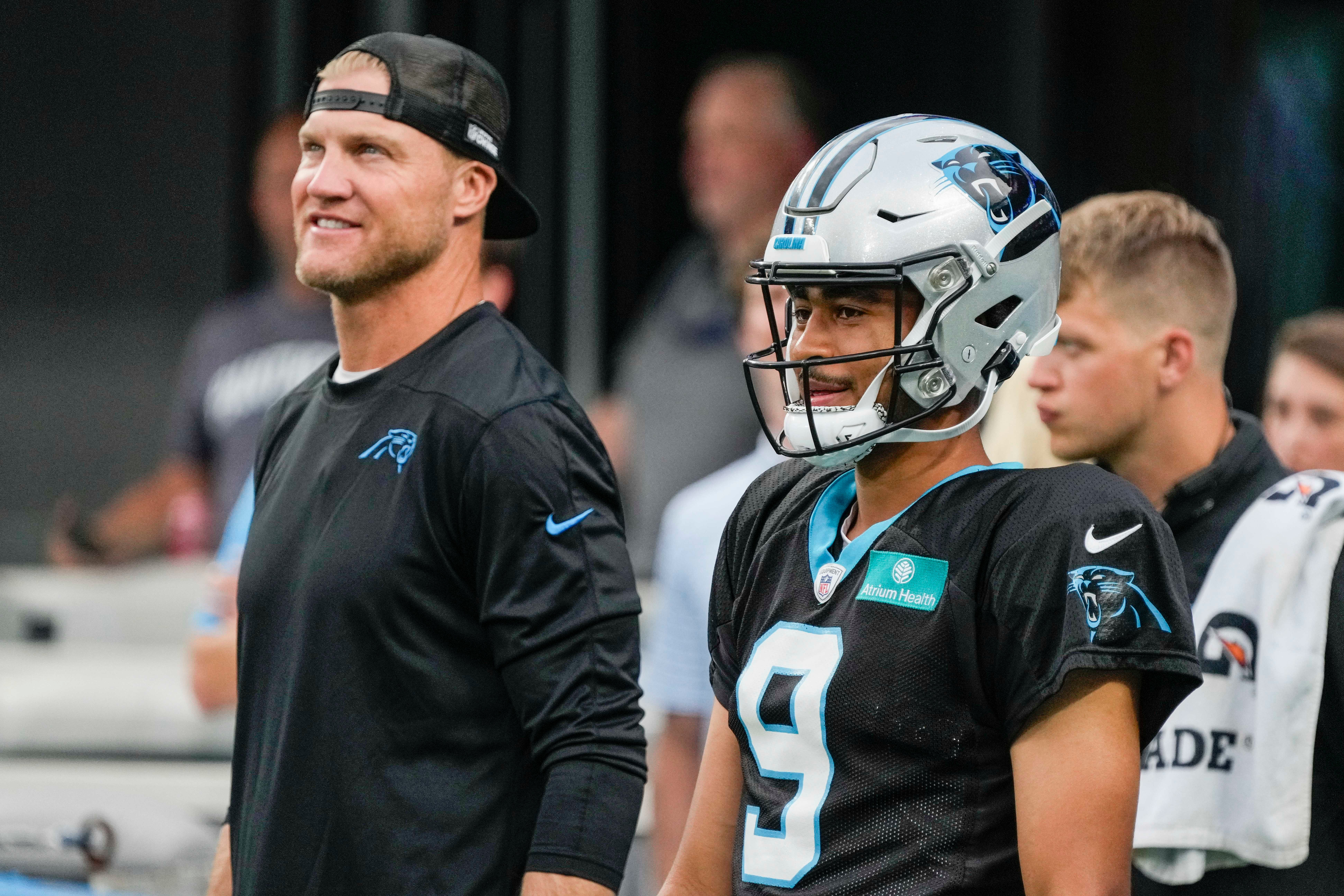 Aug 2, 2023; Charlotte, NC, USA; Quarterbacks Coach Josh McCown with quarterback Bryce Young (9) during Carolina Panthers Fan Fest at Bank of America Stadium in Charlotte.
