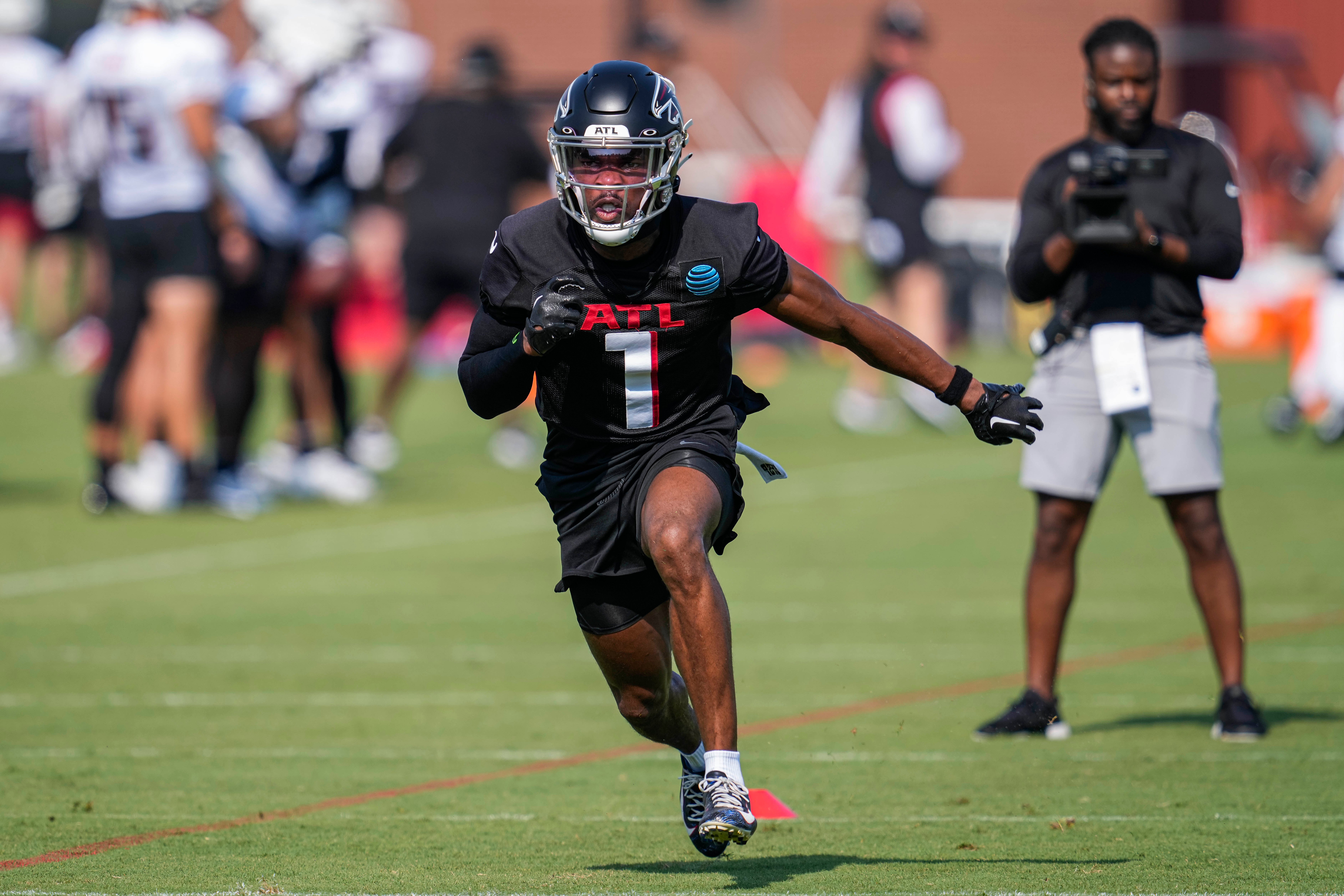 Jul 28, 2023; Flowery Branch, GA, USA; Atlanta Falcons cornerback Jeff Okudah (1) runs during a drill during training camp at IBM Performance Field.