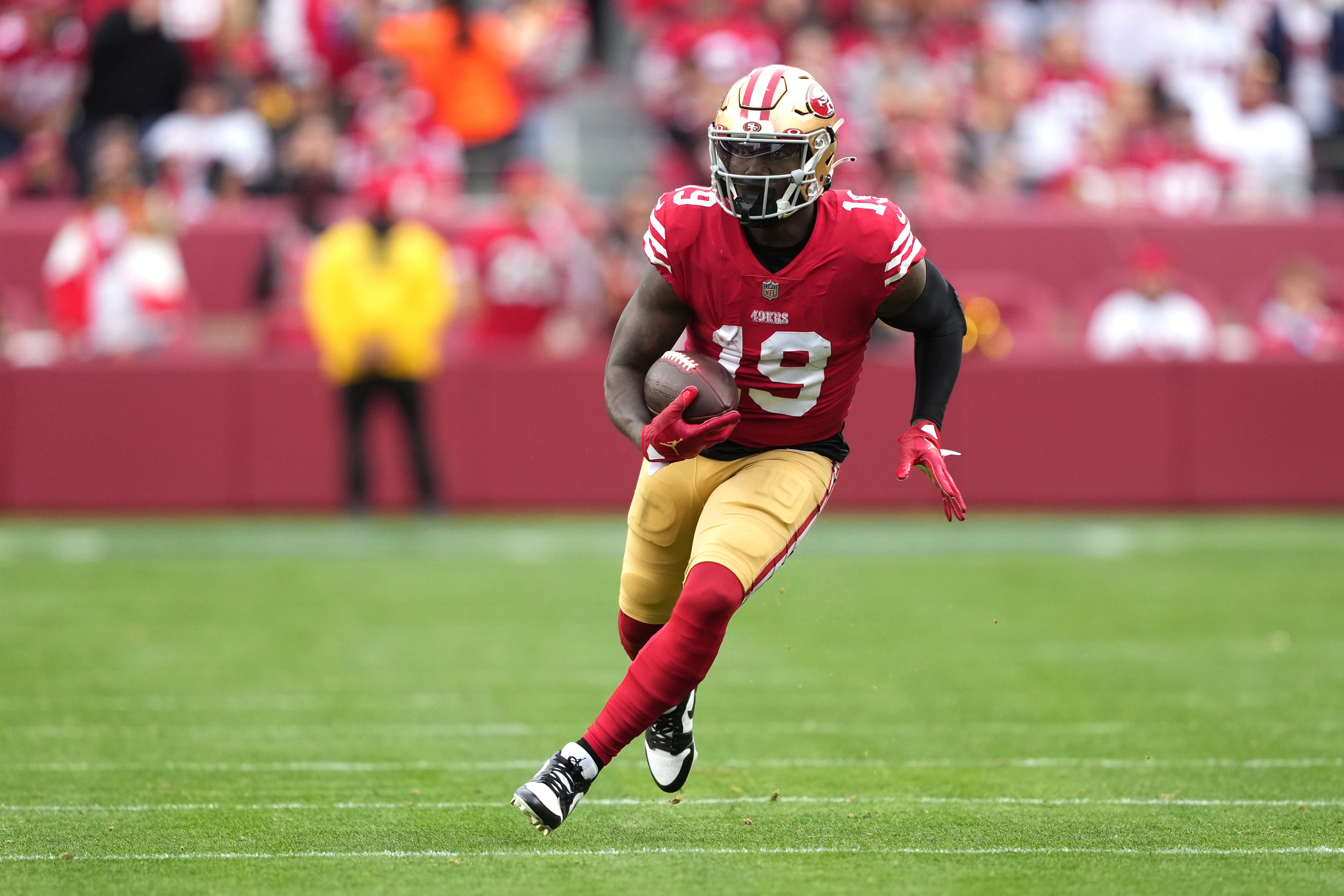 Jan 8, 2023; Santa Clara, California, USA; San Francisco 49ers wide receiver Deebo Samuel (19) runs after a catch against the Arizona Cardinals during the third quarter at Levi's Stadium. Mandatory Credit: Darren Yamashita-USA TODAY Sports
