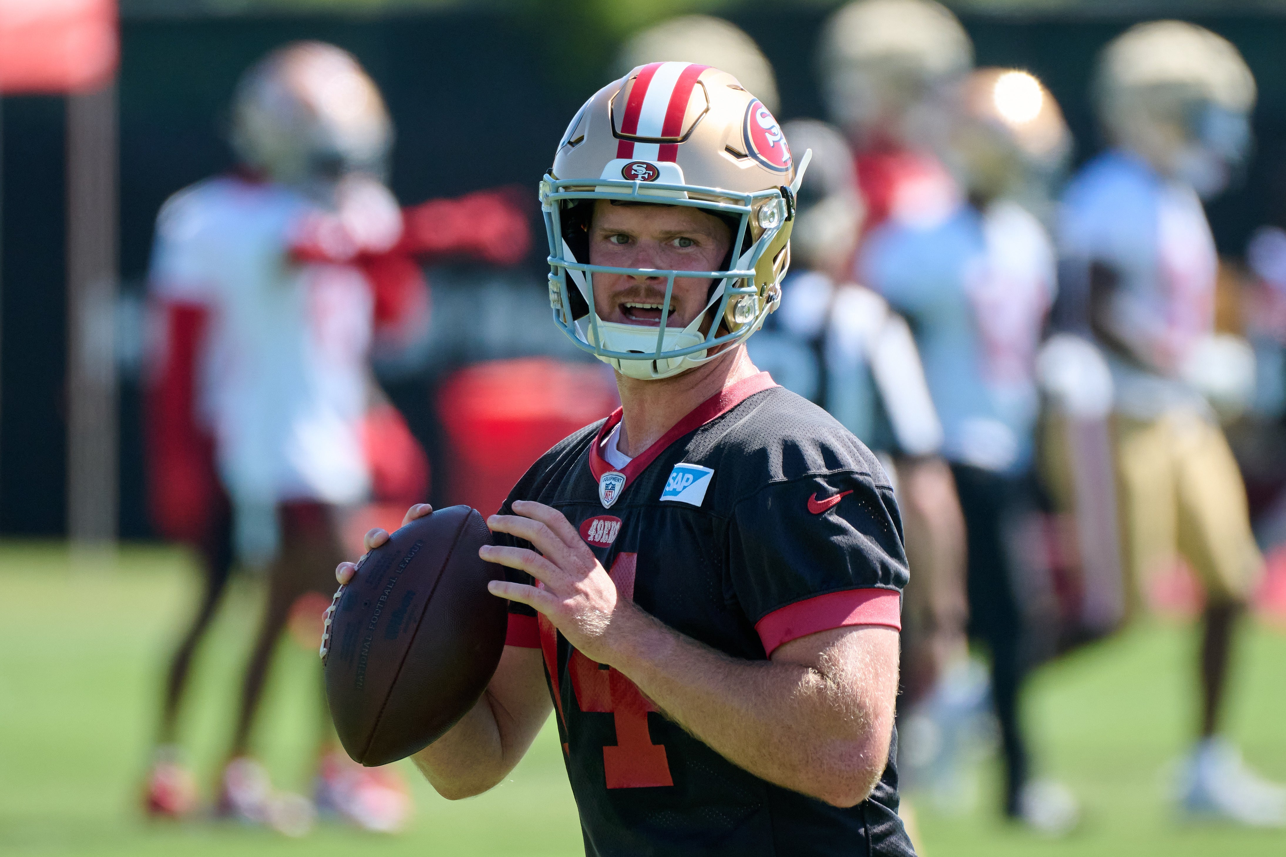 Jul 27, 2023; Santa Clara, CA, USA; San Francisco 49ers quarterback Sam Darnold (14) looks before throwing a pass during training camp at the SAP Performance Facility. Mandatory Credit: Robert Edwards-USA TODAY Sports